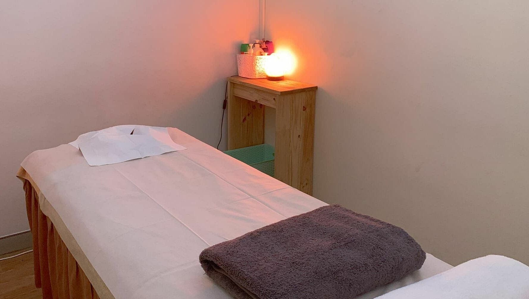 Cozy massage room at Findon Massage in Findon, South Australia, AU with a warm-lit ambiance.