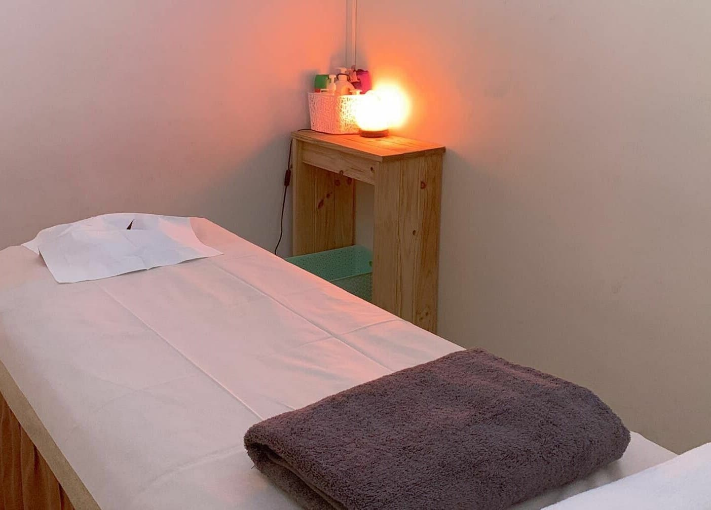 Cozy massage room at Findon Massage in Findon, South Australia, AU with a warm-lit ambiance.
