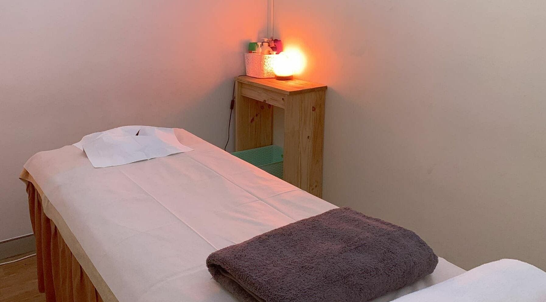 Cozy massage room at Findon Massage in Findon, South Australia, AU with a warm-lit ambiance.