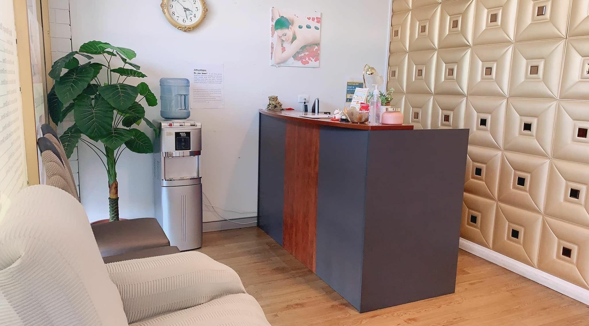 Reception area at Findon Massage in Findon, South Australia, AU, featuring modern decor and comfortable seating.