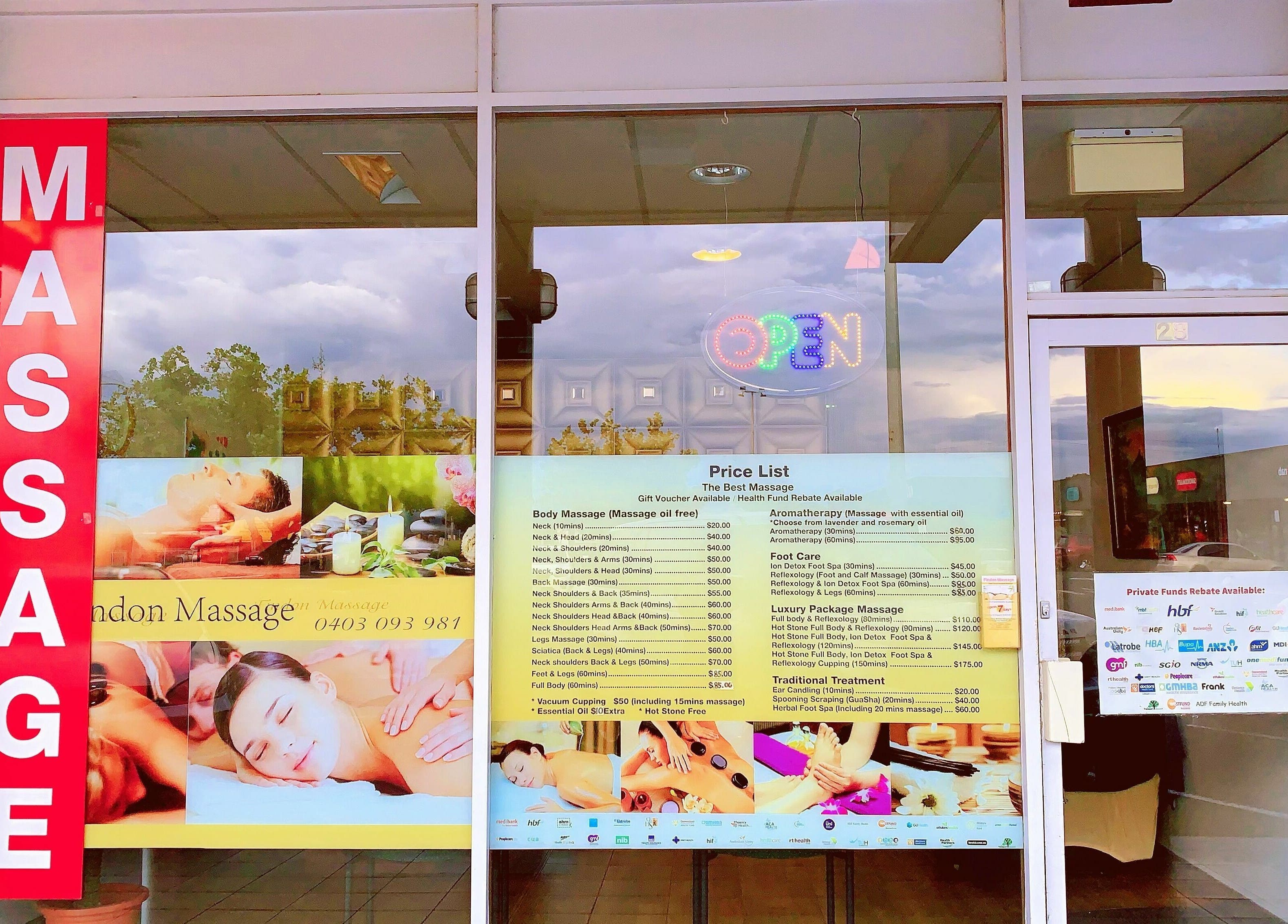 Entrance of Findon Massage in Findon, South Australia, AU with large red massage sign and service list.