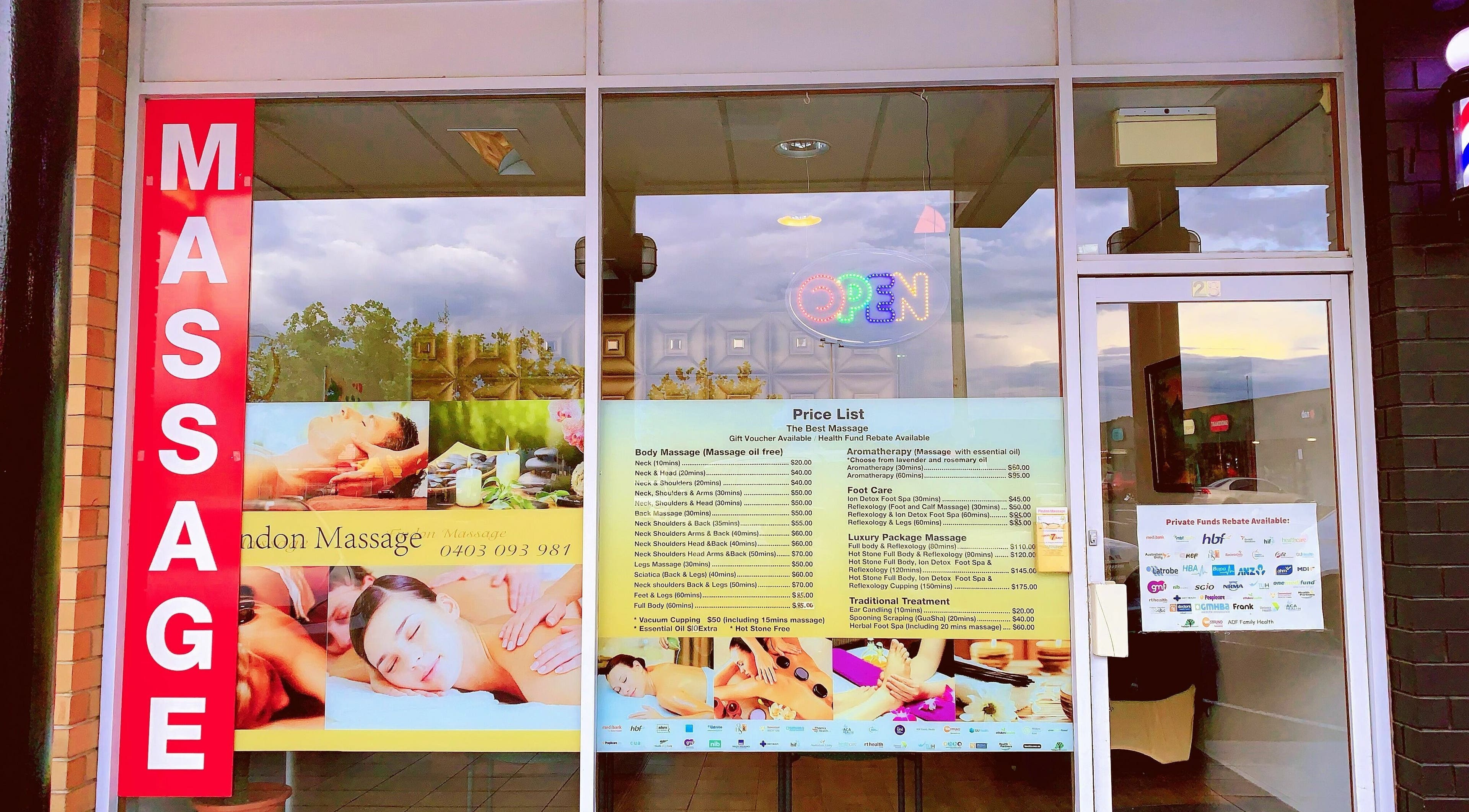 Entrance of Findon Massage in Findon, South Australia, AU with large red massage sign and service list.