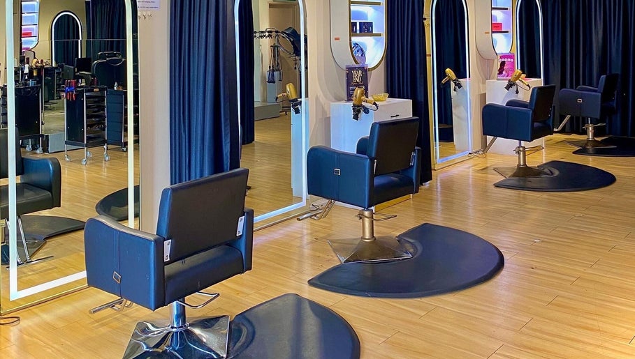 Elegant hairdressing stations at Mayssa Salon (Cyberjaya), Cyberjaya, Selangor, MY with stylish black chairs and mirrors.