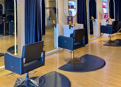 Elegant hairdressing stations at Mayssa Salon (Cyberjaya), Cyberjaya, Selangor, MY with stylish black chairs and mirrors.