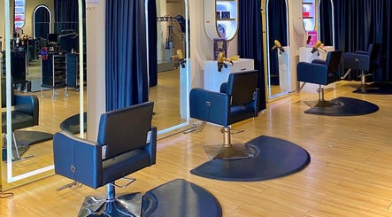 Elegant hairdressing stations at Mayssa Salon (Cyberjaya), Cyberjaya, Selangor, MY with stylish black chairs and mirrors.