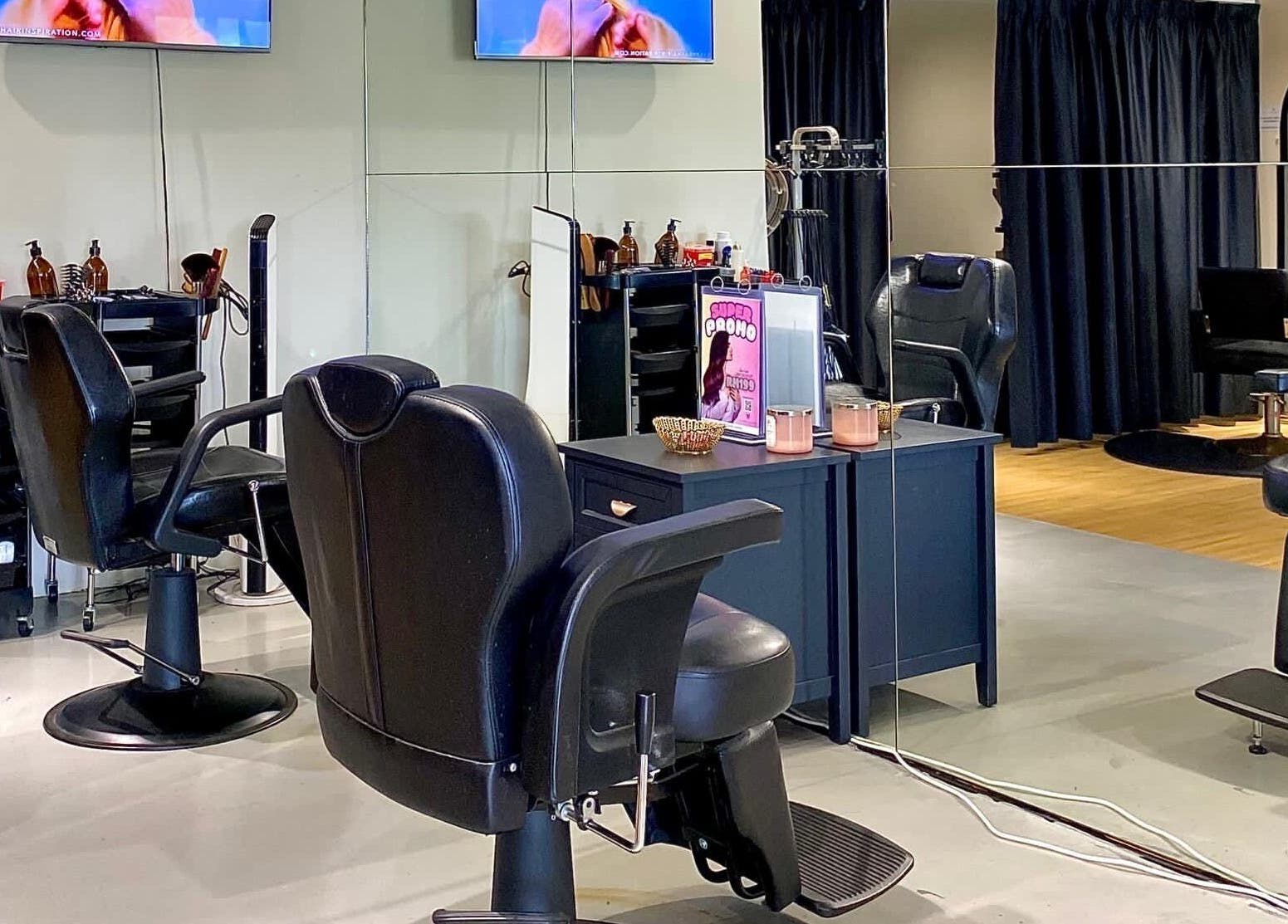 Modern salon interior at Mayssa Salon (Cyberjaya), Cyberjaya, Selangor, MY, featuring stylish black chairs and mirrors.