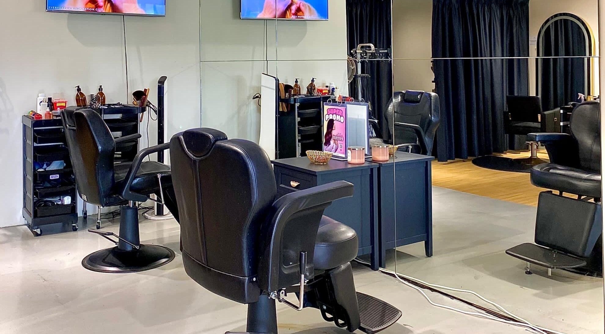 Modern salon interior at Mayssa Salon (Cyberjaya), Cyberjaya, Selangor, MY, featuring stylish black chairs and mirrors.