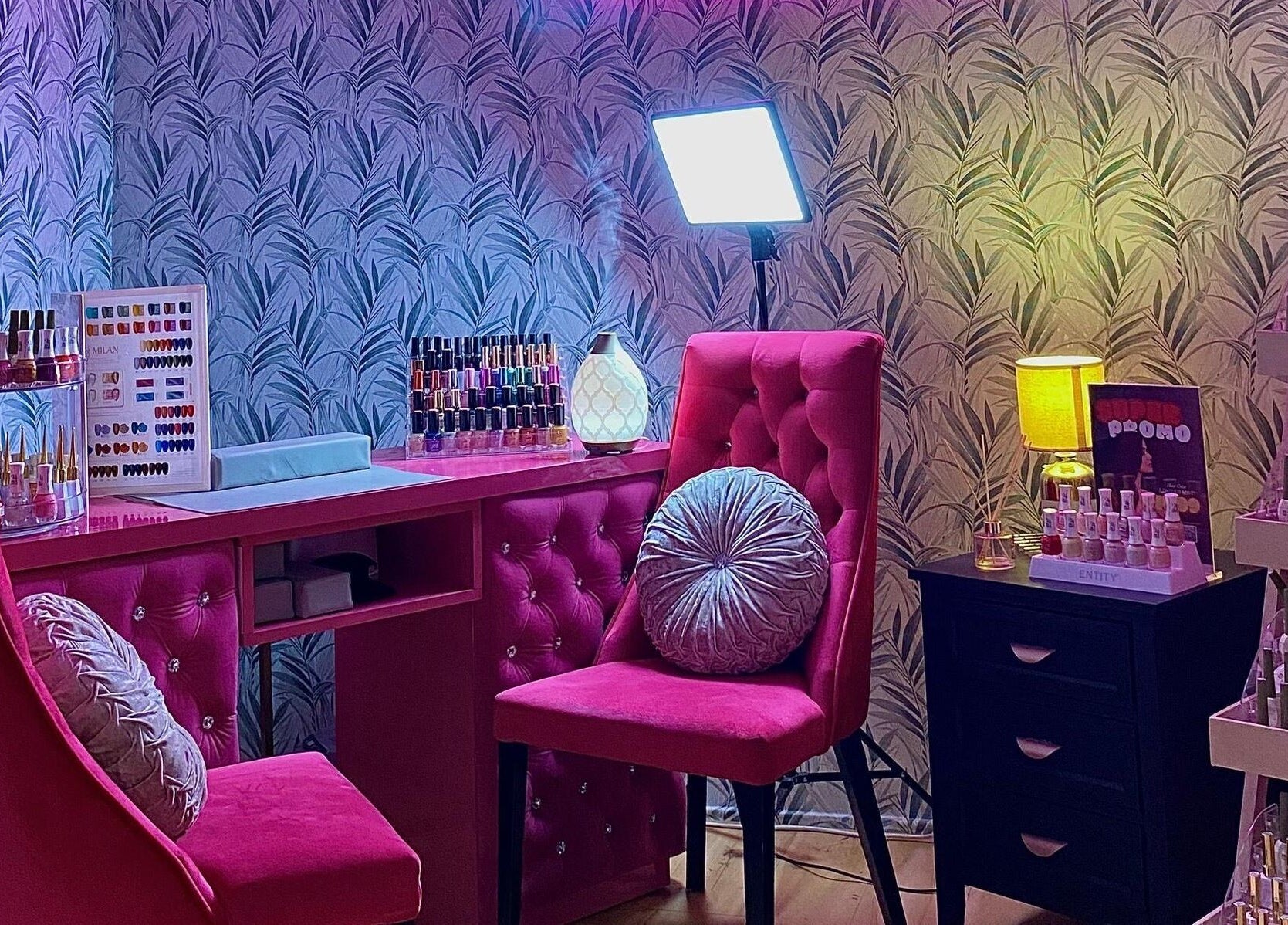 Chic nail station at Mayssa Salon (Cyberjaya), Cyberjaya, Selangor, MY. Bright pink chairs and organized nail polishes.