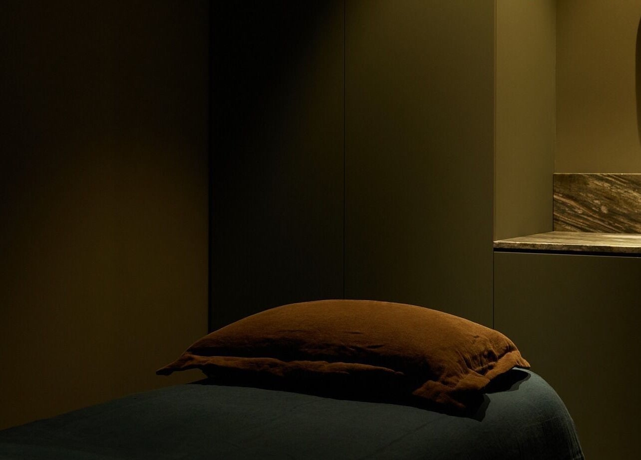 Relaxing spa room at Comma Byron Bay, featuring a plush massage table in Byron Bay, New South Wales, AU.