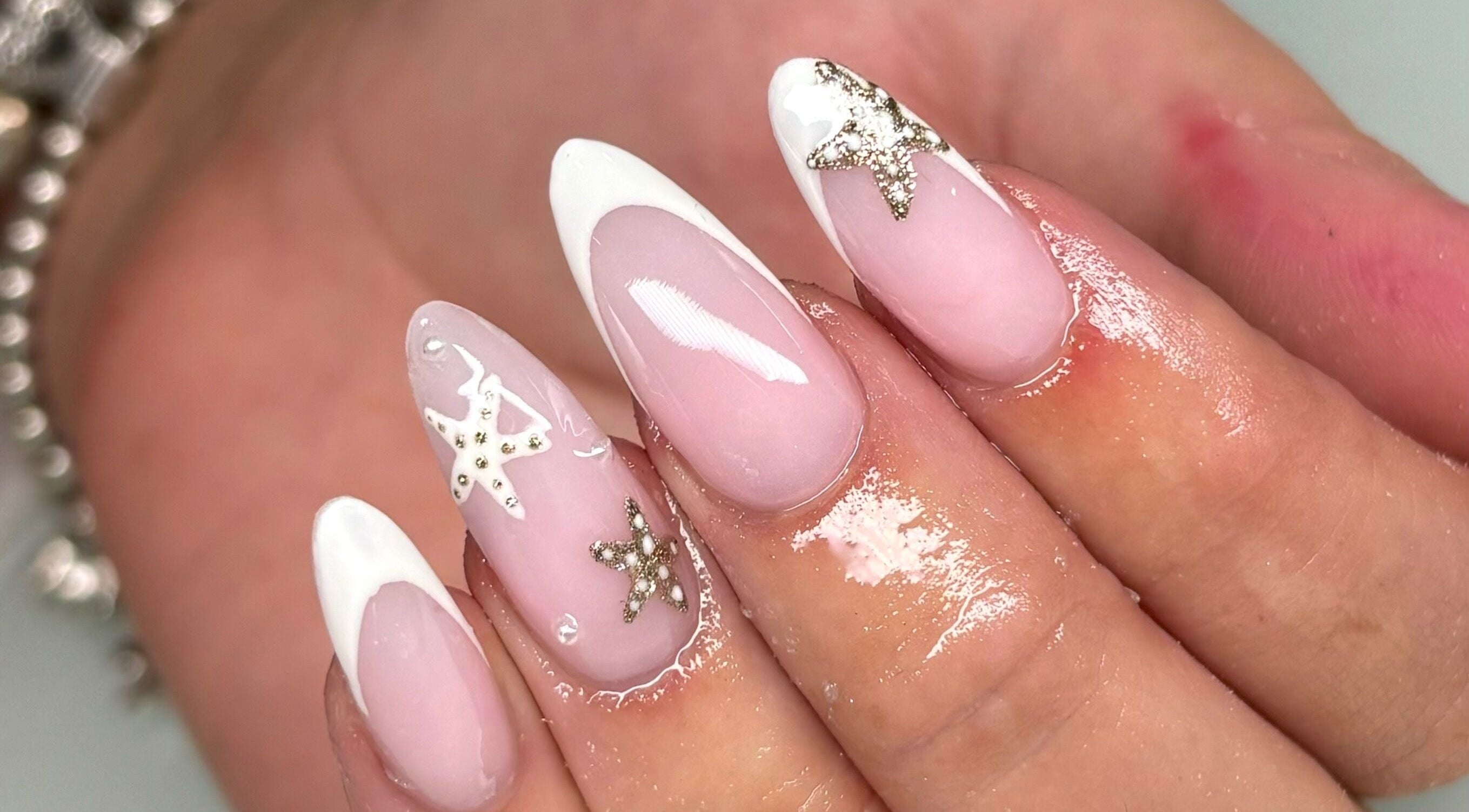 Elegant star-adorned nails at Beauty by Mollie, Burnley, England, GB. Perfect for stylish manicures.