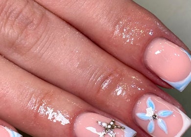 Elegant nail art featuring floral designs at Beauty by Mollie, Burnley, England, GB.