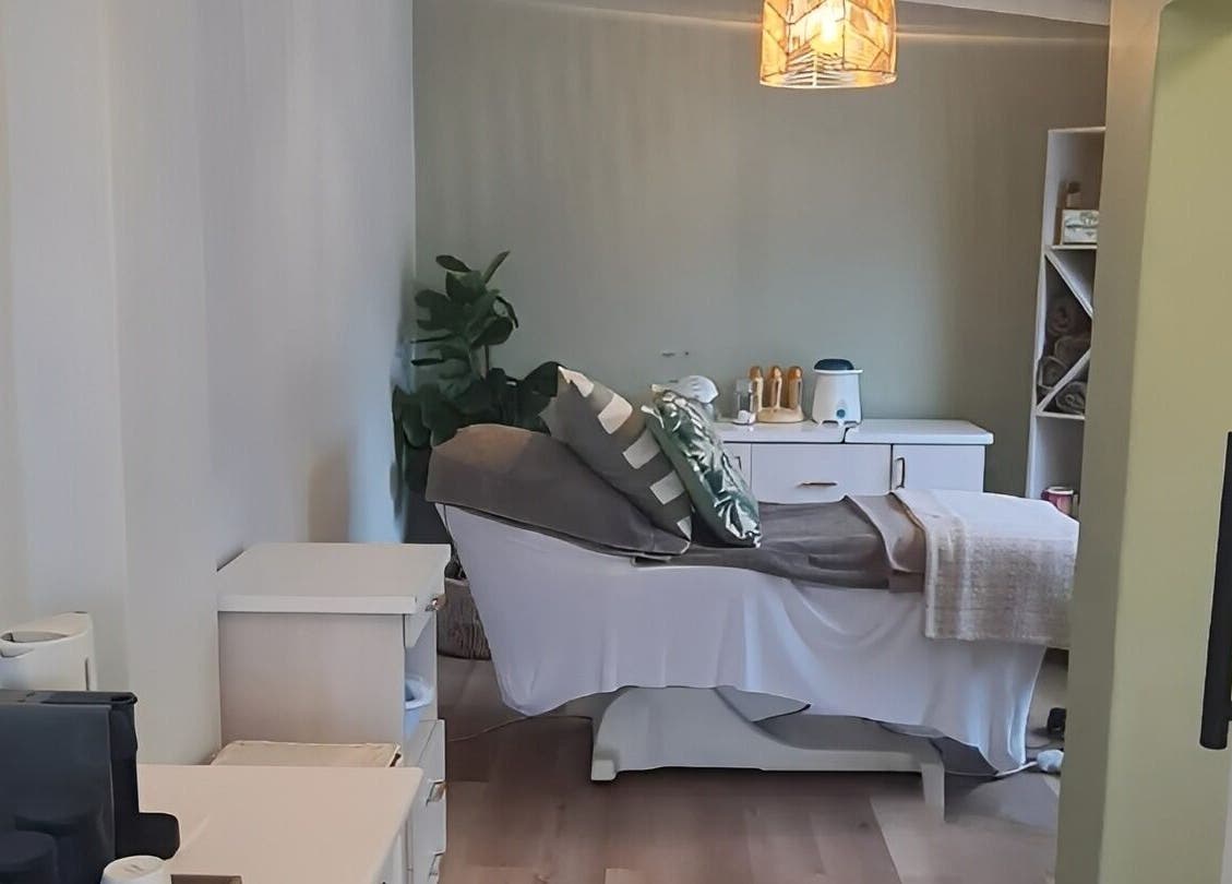 Tranquil spa room at Beauty by Kristy, Gqeberha, Eastern Cape, ZA, with a massage bed and soothing decor.