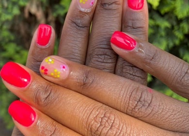 Vibrant floral nail art by JudyM Beauty in Kempton Park, Gauteng, ZA showcasing colorful manicured hands.