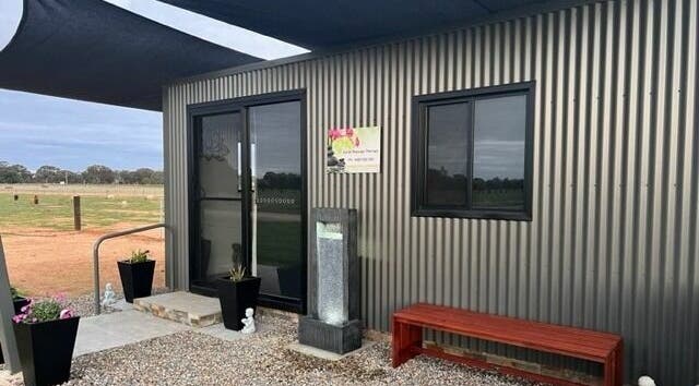 Entrance of Kylah Massage - Rochester Clinic in Diggora, Victoria, AU featuring modern design and outdoor decor.
