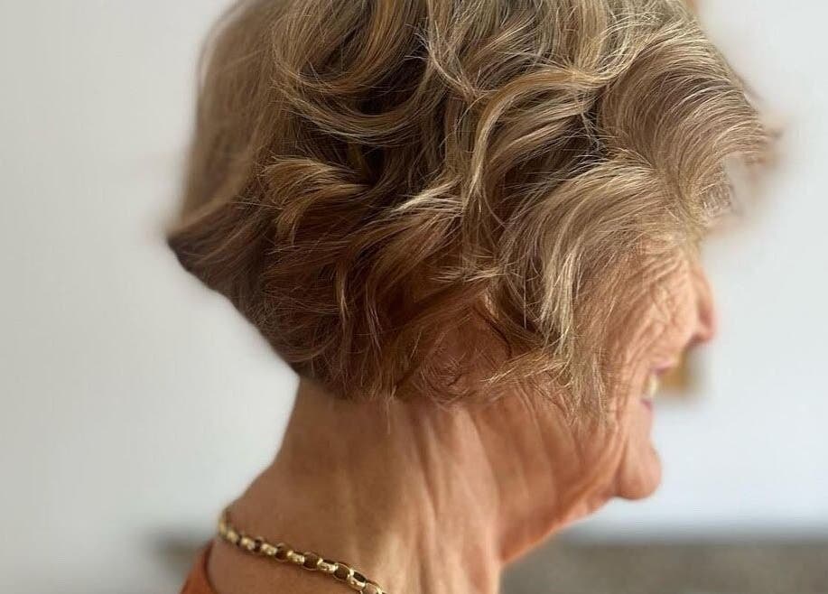 Elegant hairstyle with soft curls at Execute Hair, Beauty & Barbering, Kewarra Beach, Queensland, AU.