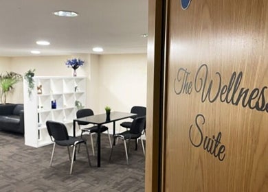 Cozy wellness suite at Advanced Aesthetics Clinic Ltd - Tiptree, Tiptree, England, GB with table and chairs.