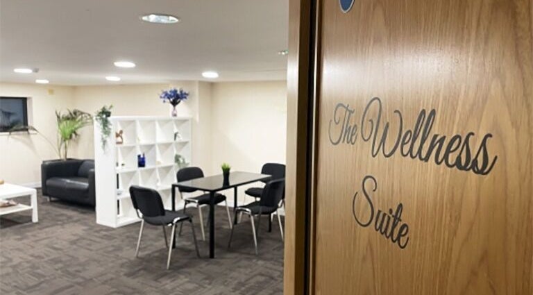 Cozy wellness suite at Advanced Aesthetics Clinic Ltd - Tiptree, Tiptree, England, GB with table and chairs.