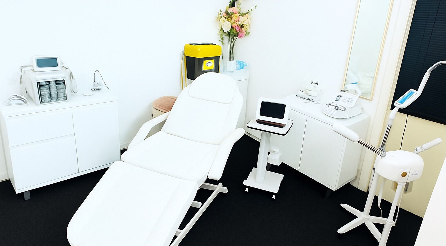 Modern treatment room at Lovell Beauty and Aesthetics, Colchester, England, GB, showcasing professional equipment.