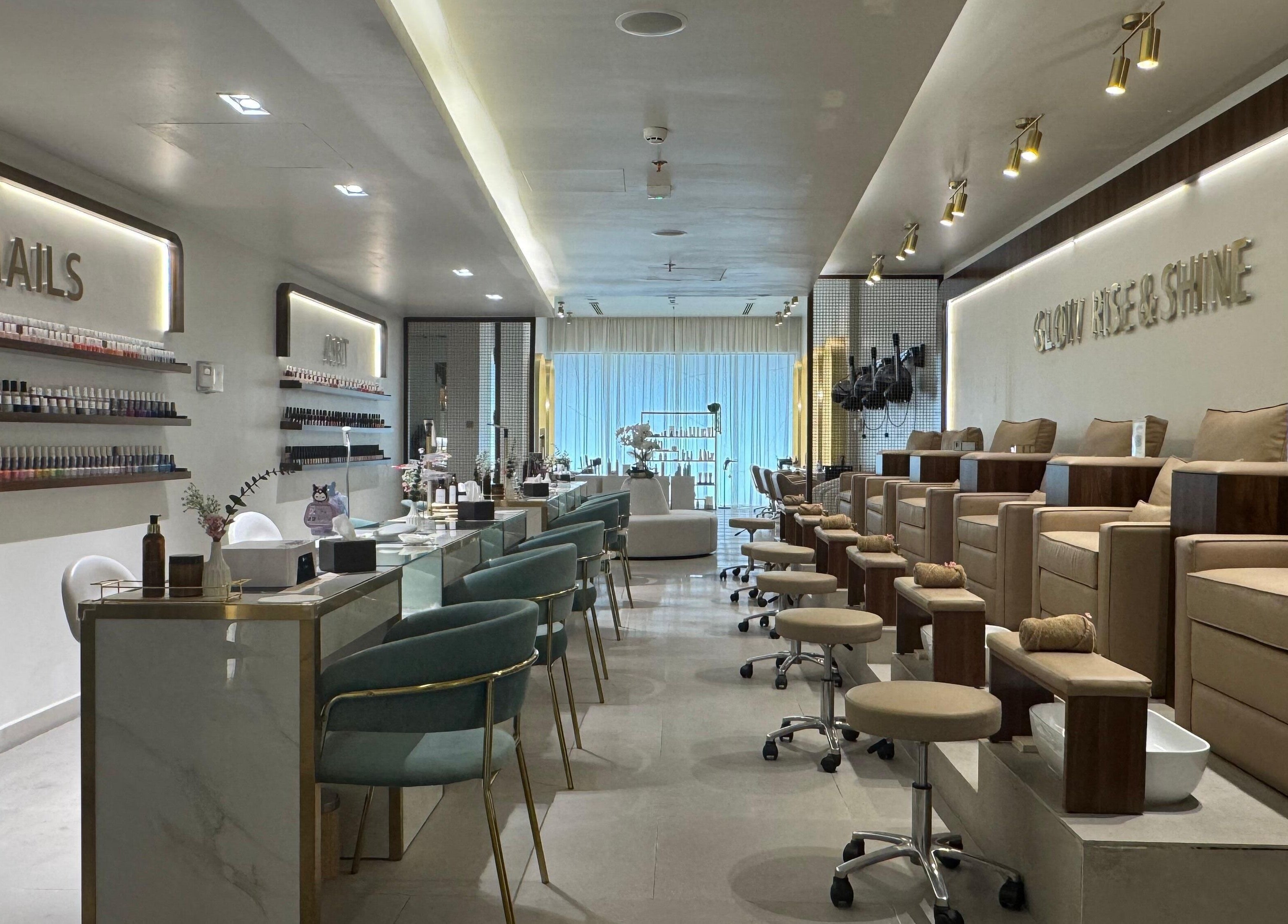 Abreez Beauty Salon's sleek nail area in Sharjah, Sharjah, AE with modern decor and plush chairs.