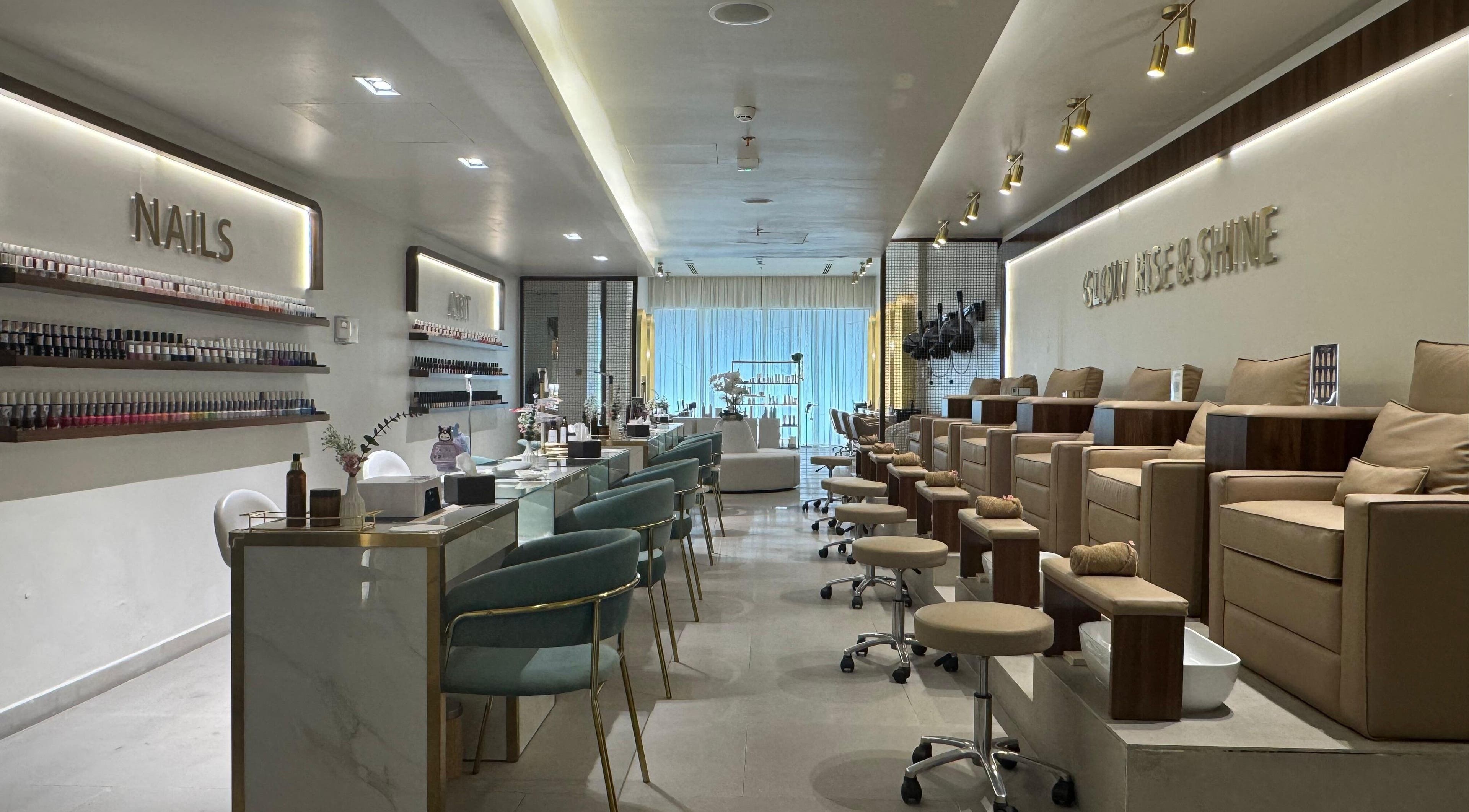 Abreez Beauty Salon's sleek nail area in Sharjah, Sharjah, AE with modern decor and plush chairs.