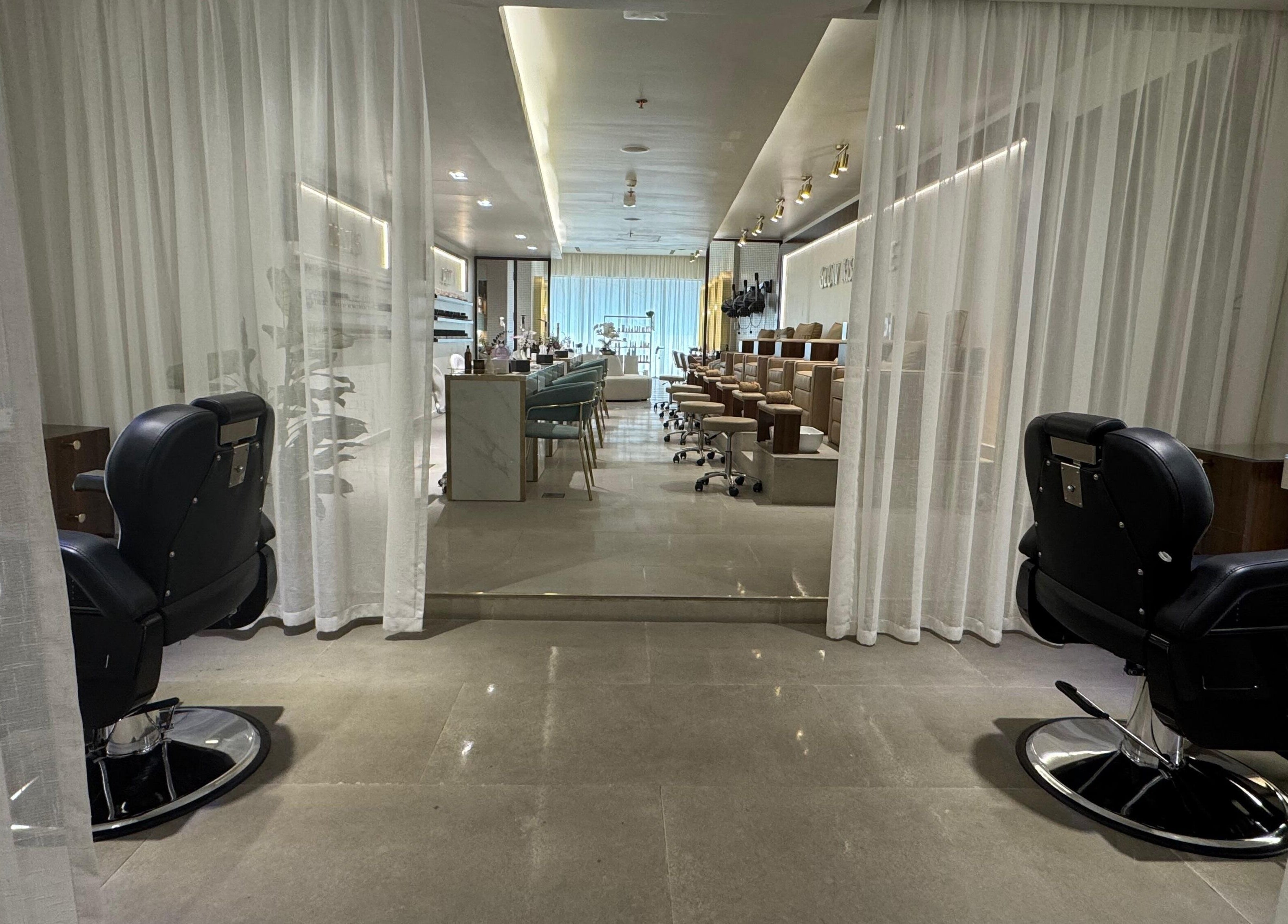 Chic interior of Abreez Beauty Salon, Sharjah with modern chairs and serene ambiance.