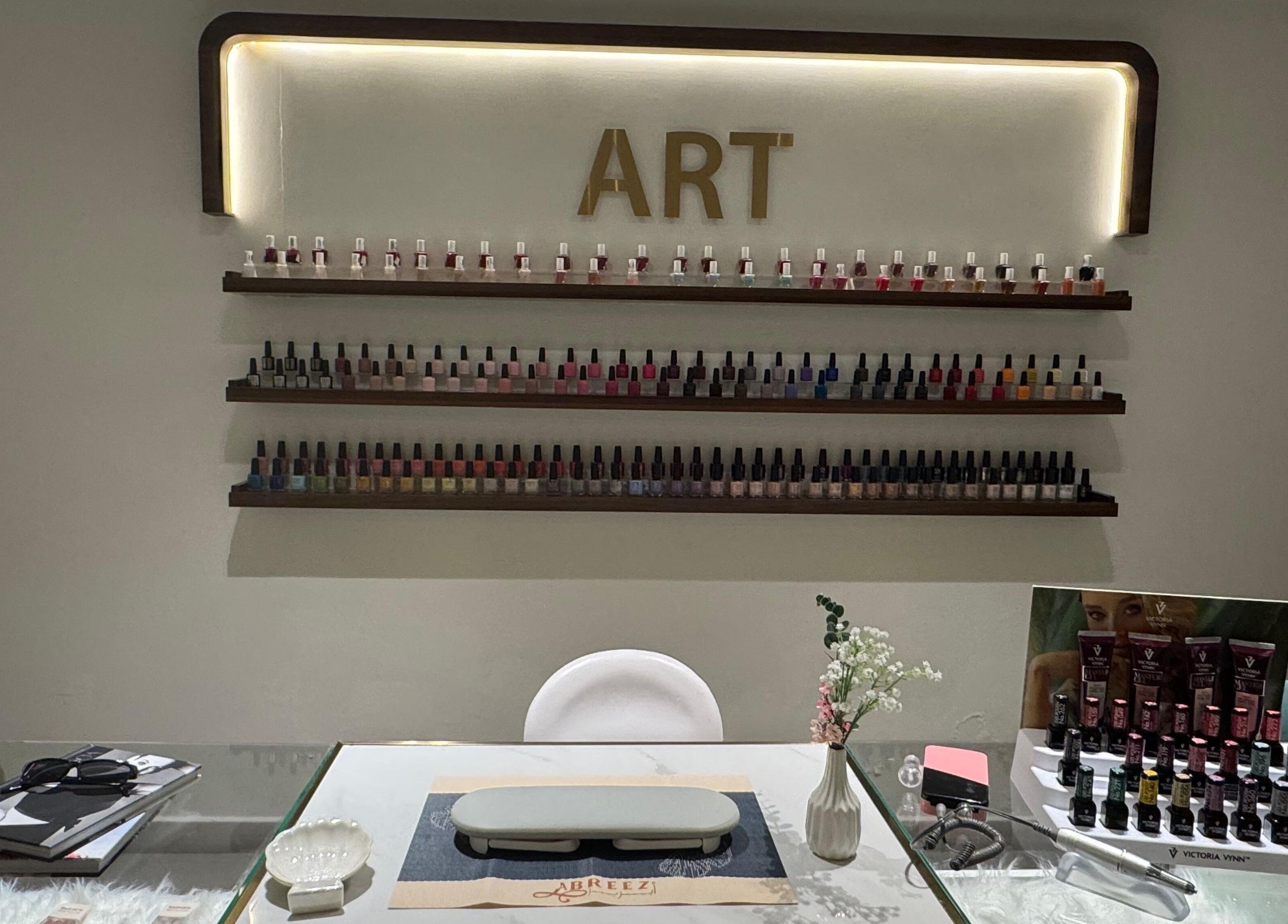 Nail polish display at Abreez Beauty Salon, Sharjah, AE, showcasing a variety of colors.