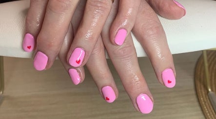 Elegant pink nails with heart accents at Kazumi Beauty by Tanya Duff, Dumfries, Scotland, GB.
