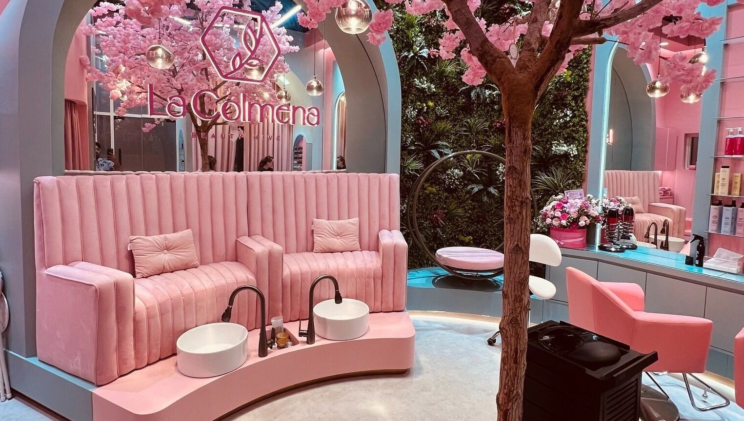 Elegant pink salon interior with floral decor at La Colmena Beauty Hive, Dubai, Dubai, AE.