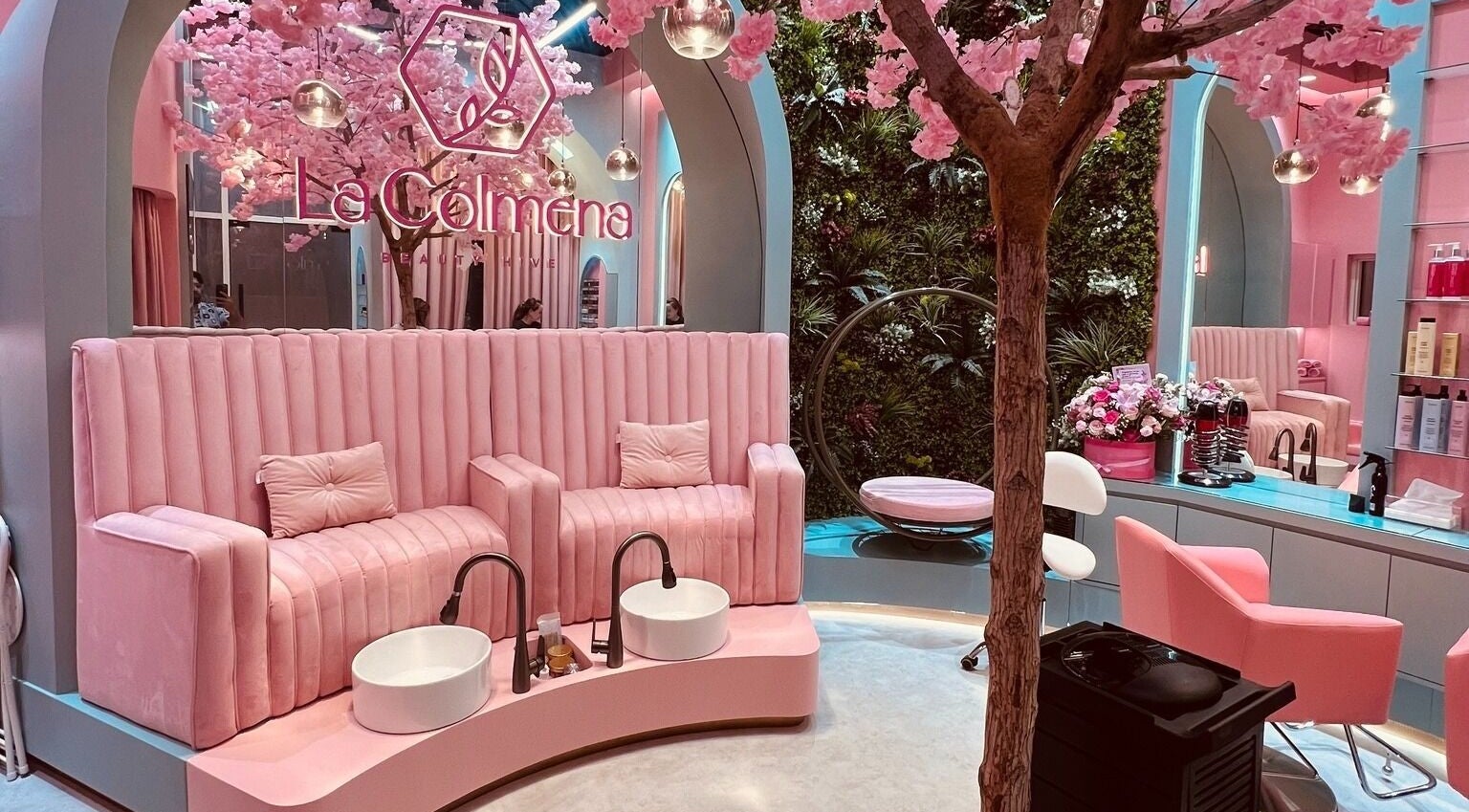 Elegant pink salon interior with floral decor at La Colmena Beauty Hive, Dubai, Dubai, AE.