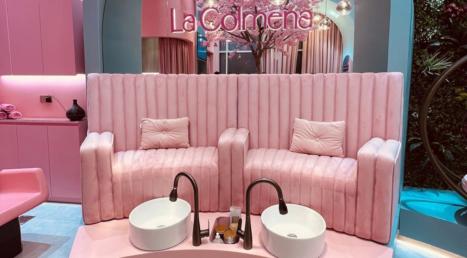 Luxurious pink spa seating at La Colmena Beauty Hive, Dubai, Dubai, AE, with plush decor and pedicure setup.