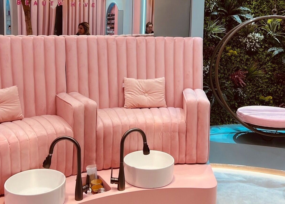 Luxurious pink seating and greenery at La Colmena Beauty Hive, Dubai, Dubai, AE create a serene ambiance.