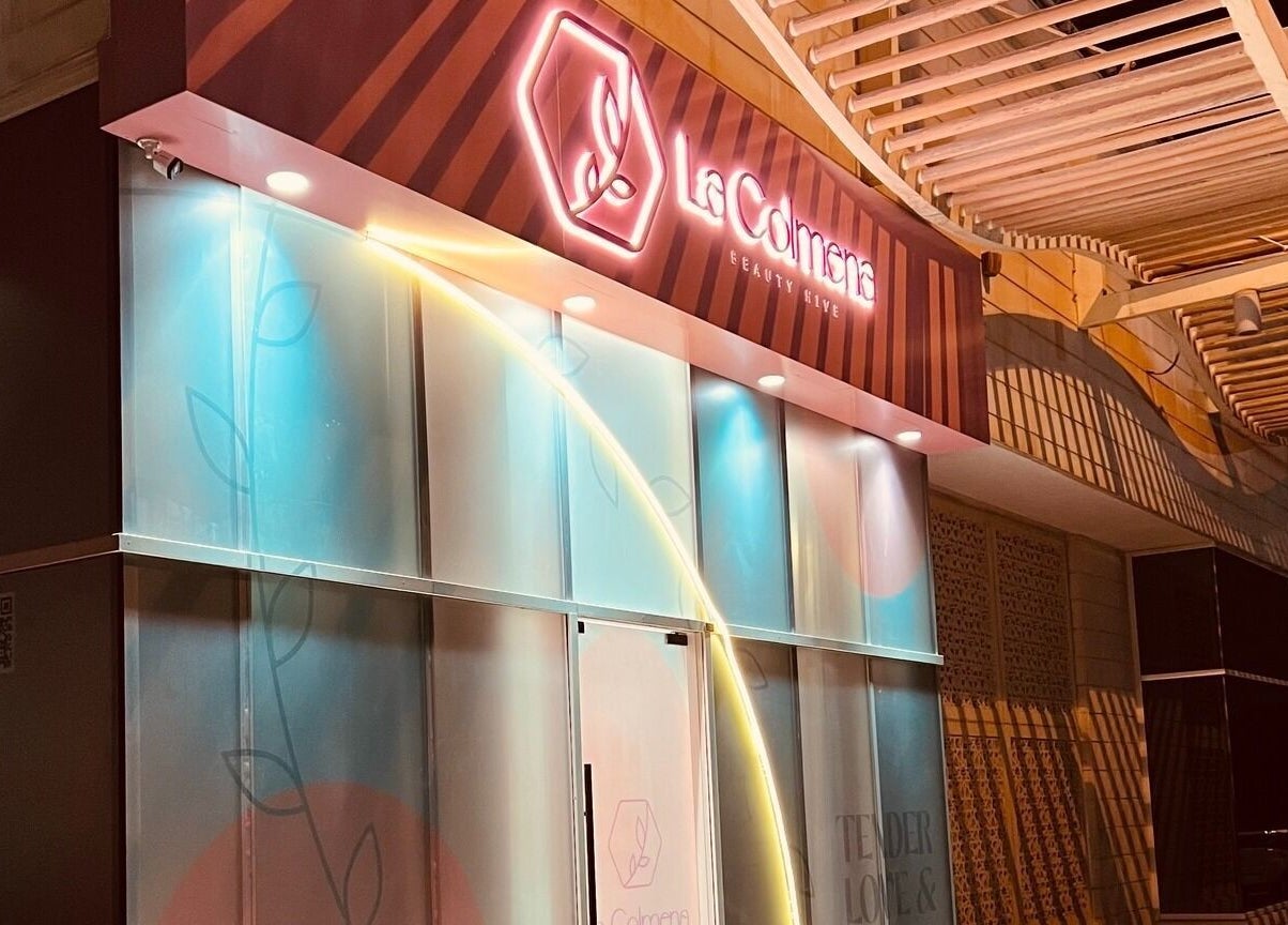 Exterior view of La Colmena Beauty Hive, Dubai, Dubai, AE, showcasing vibrant signage and modern design.