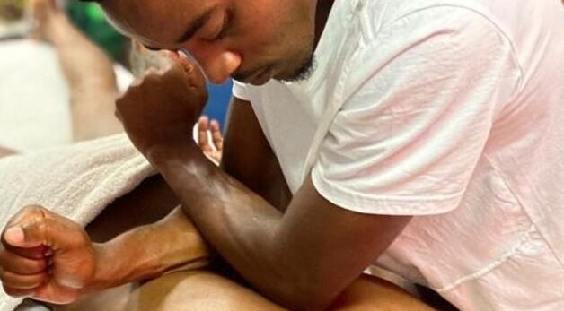 Therapist at Emmanuel Massage Studio in Cape Town, Western Cape, ZA giving a client a professional massage.