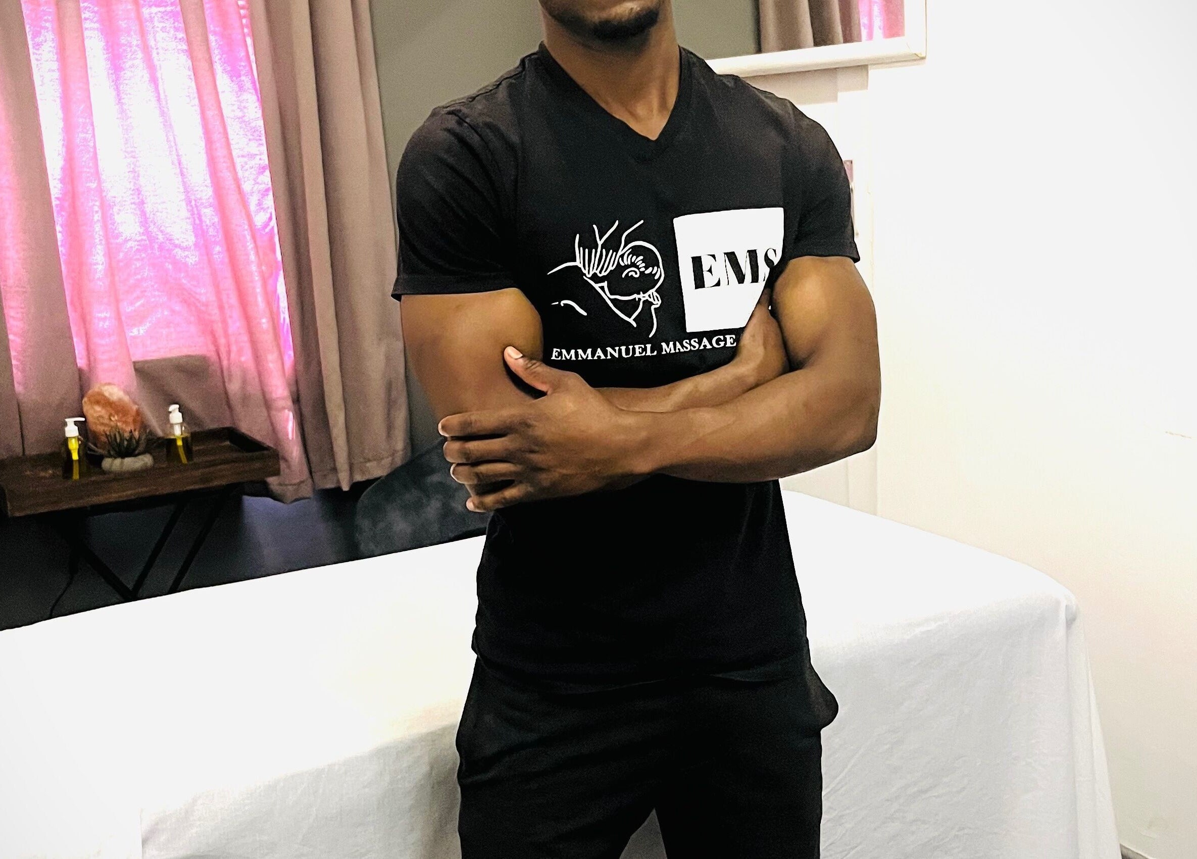 Therapist at Emmanuel Massage Studio in Cape Town, Western Cape, ZA, creating a calm atmosphere.