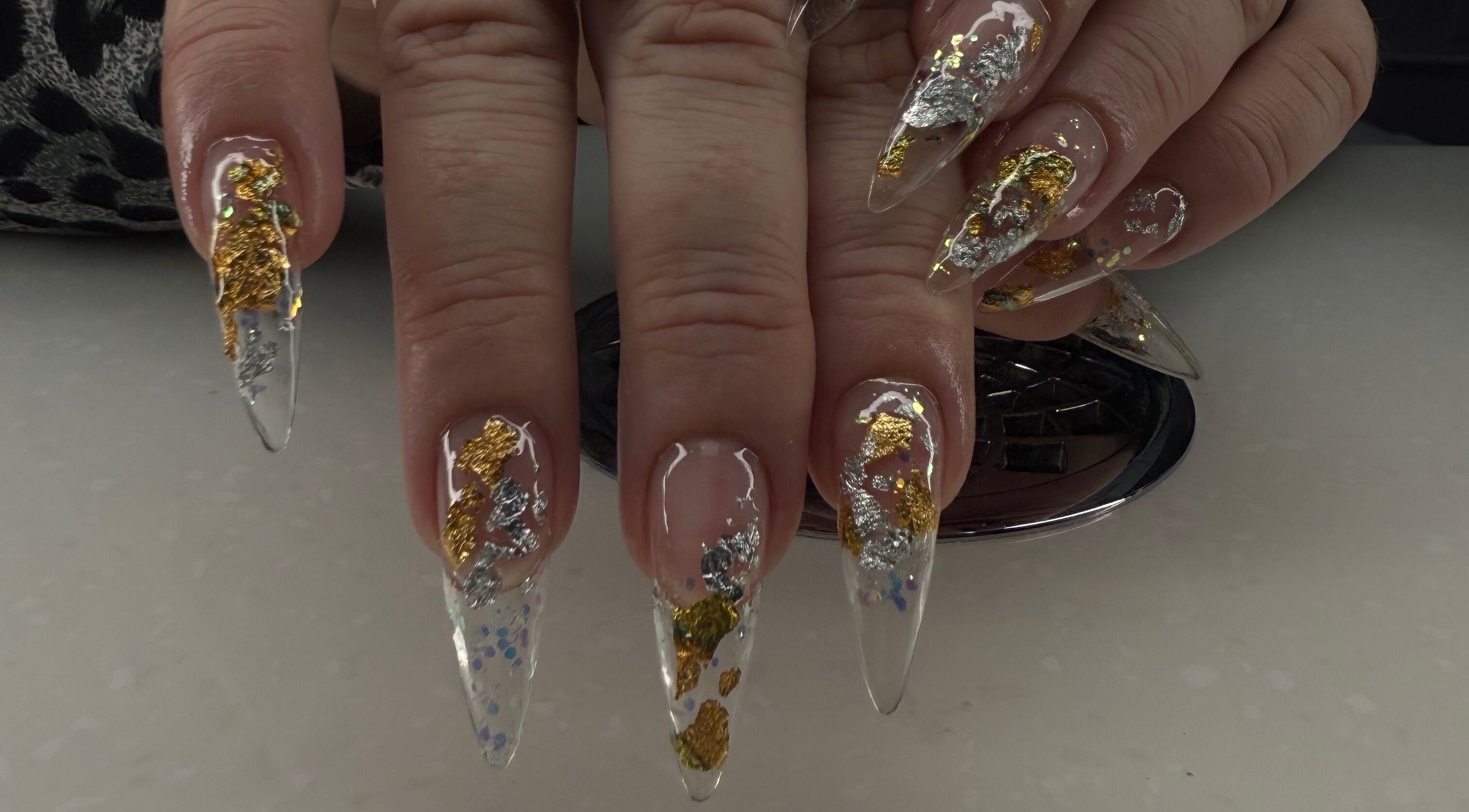 Intricate nail art with gold foil design at Spa Bijou, George Town, George Town, KY.