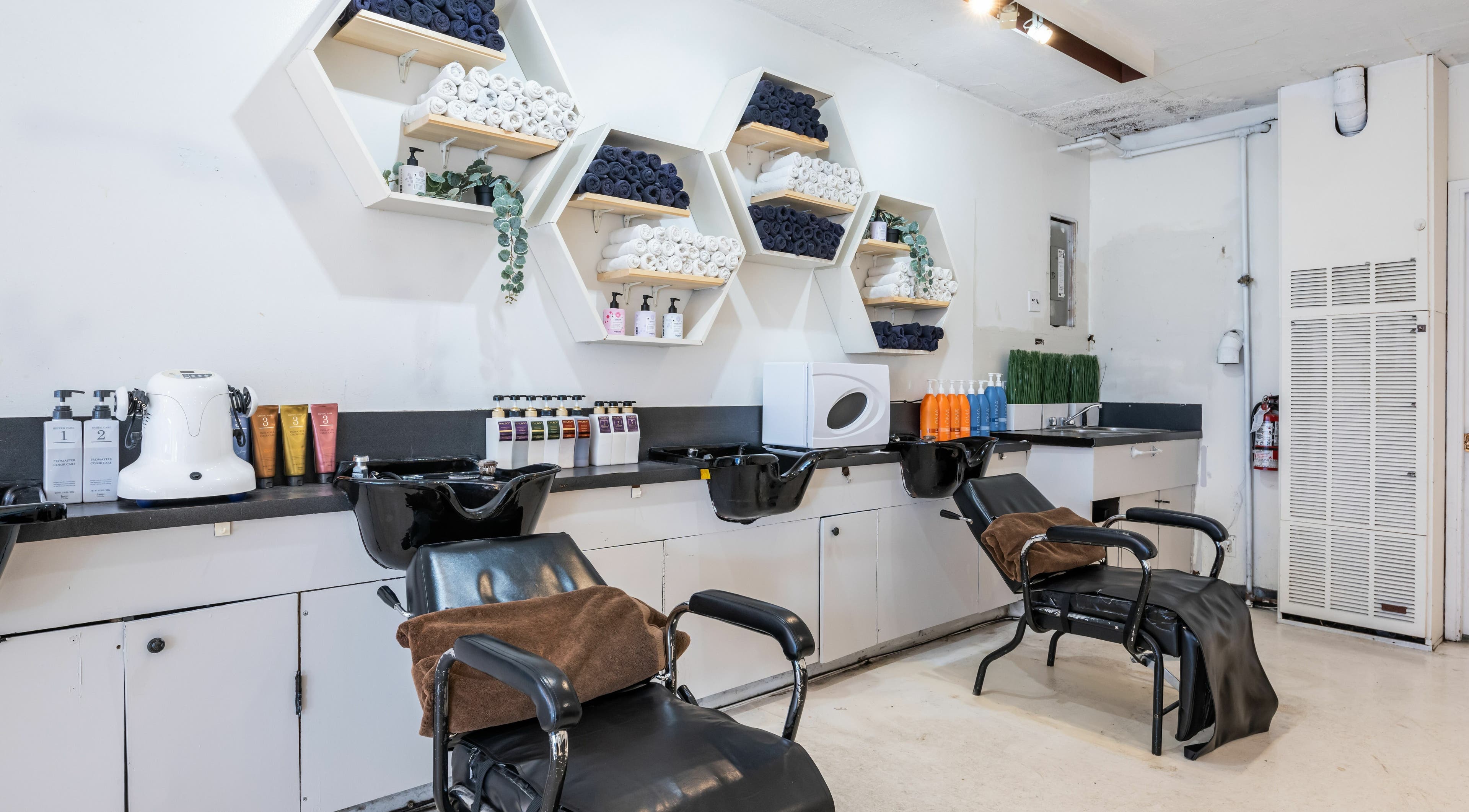 Modern styling stations at Hive Hair Spa at Oak in Vancouver, British Columbia, CA, showcasing sleek design and elegance.