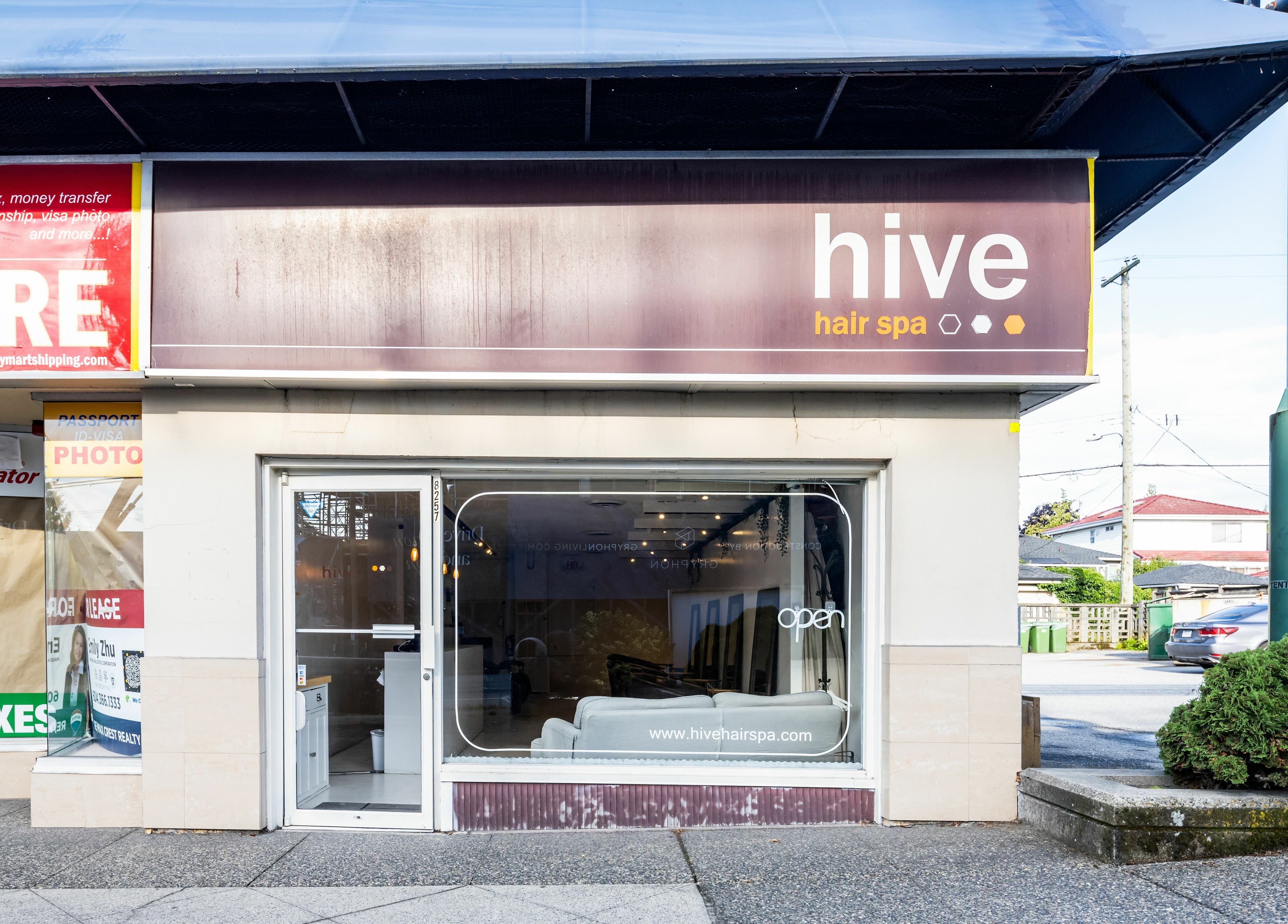 Front view of Hive Hair Spa at Oak, Vancouver, BC, CA, showcasing modern storefront and inviting entrance.