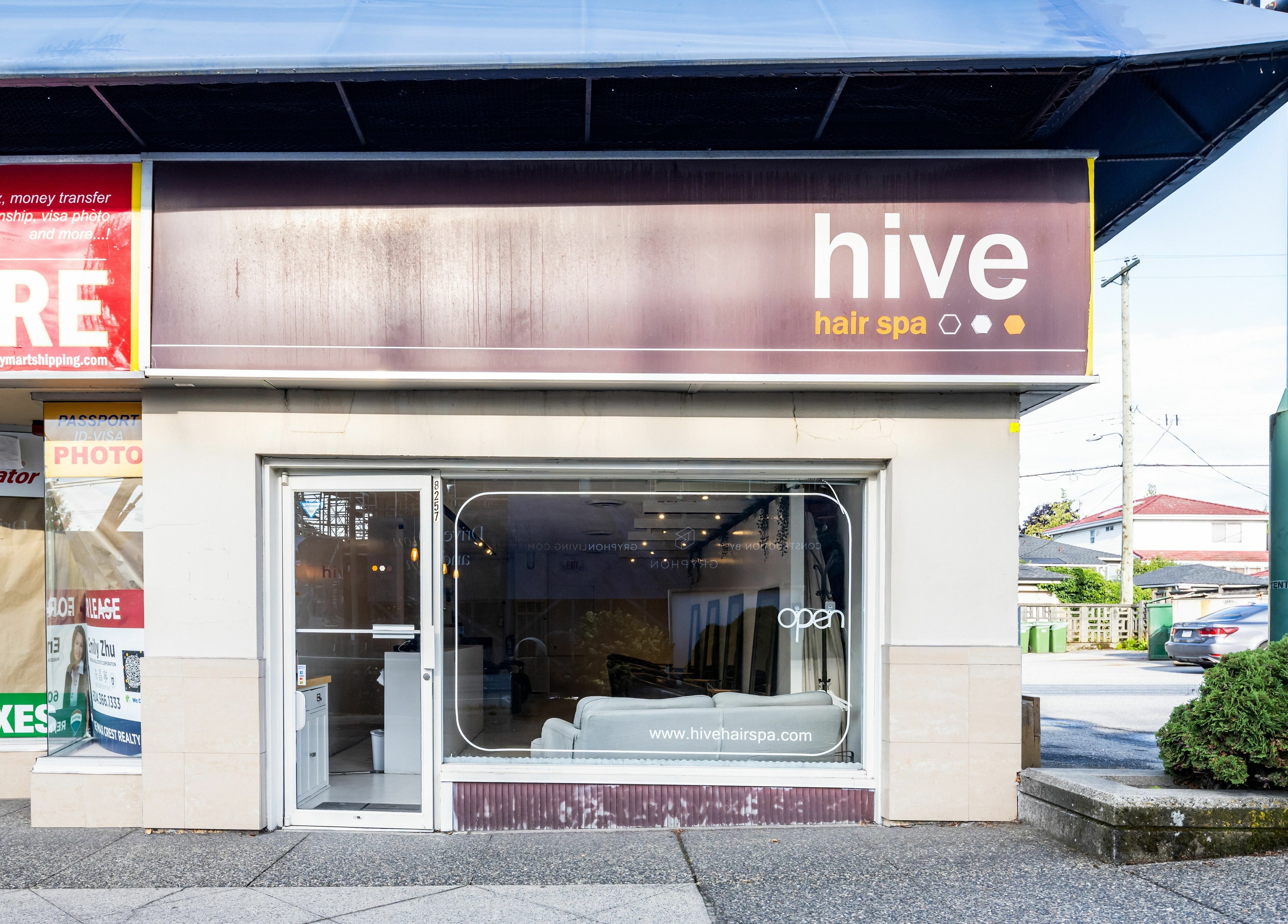 Front view of Hive Hair Spa at Oak, Vancouver, BC, CA, showcasing modern storefront and inviting entrance.