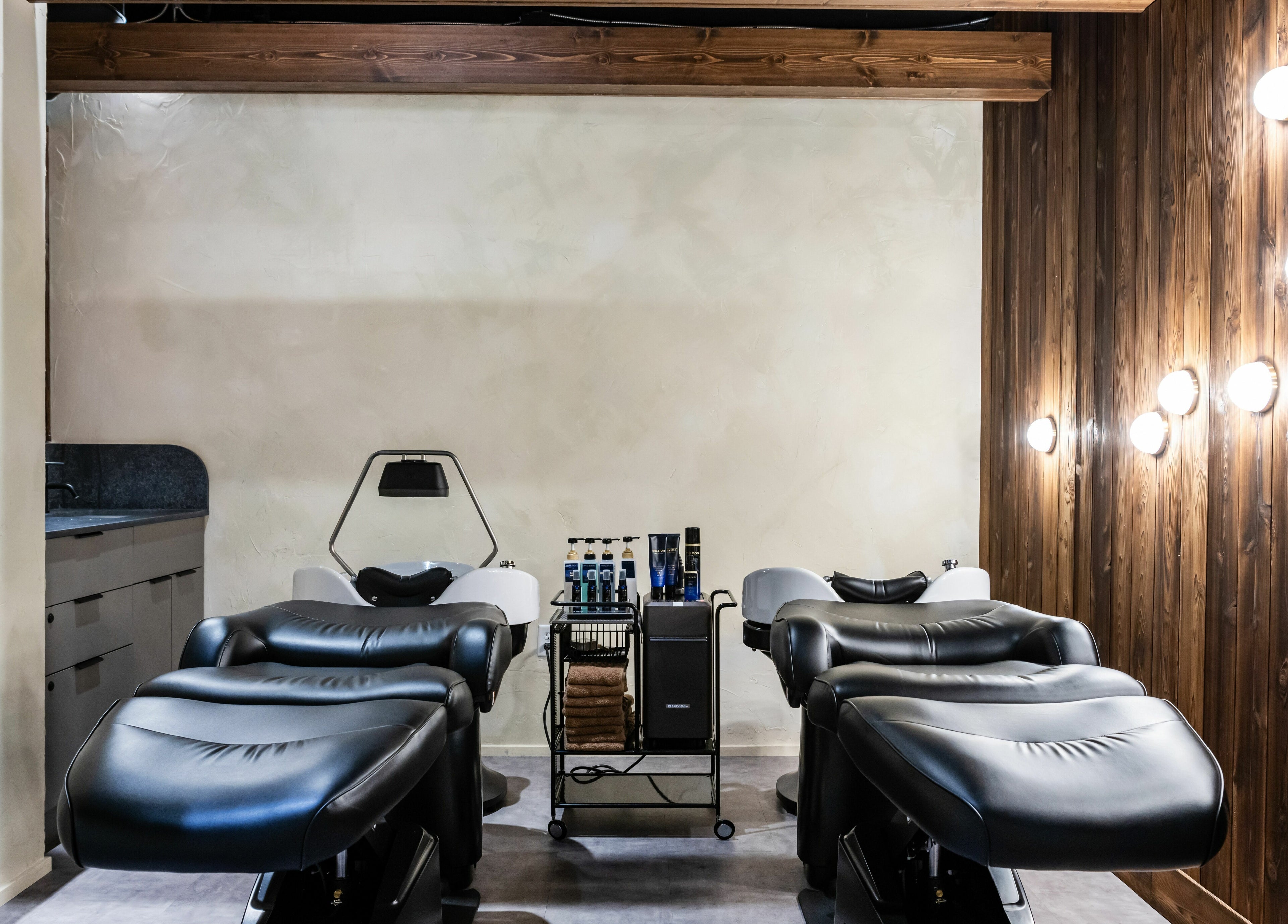 Sleek salon chairs at Hive Hair Spa | Broadway in Vancouver, British Columbia, CA for ultimate relaxation.