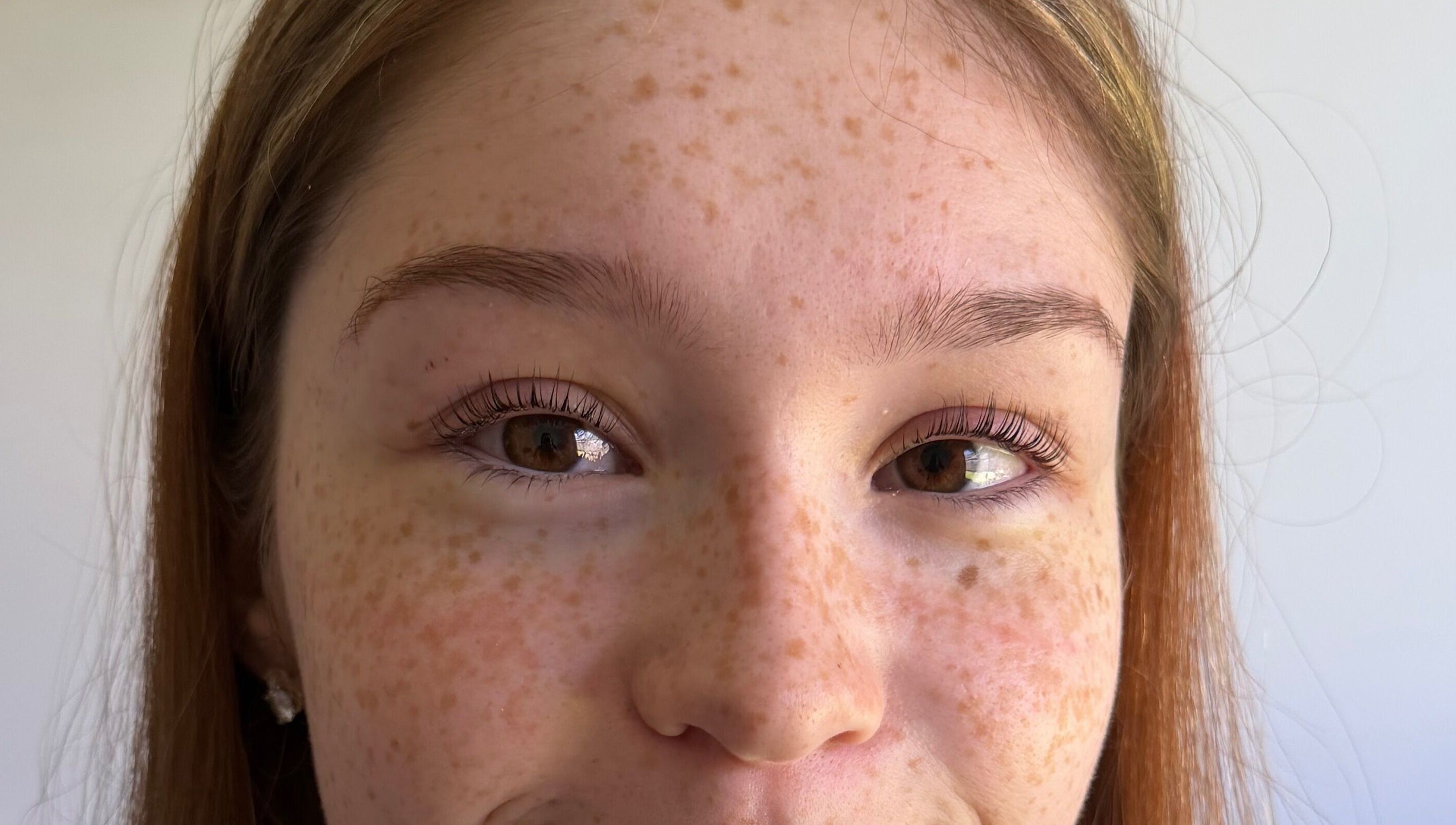 Close-up of a woman's face showcasing natural beauty at West Beauty Haus - RBP, Redbank Plains, Queensland, AU.