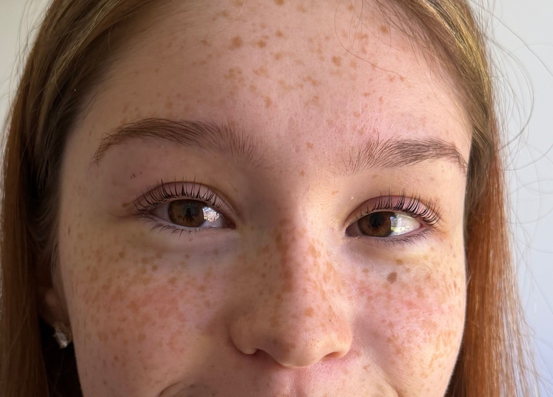 Close-up of a woman's face showcasing natural beauty at West Beauty Haus - RBP, Redbank Plains, Queensland, AU.