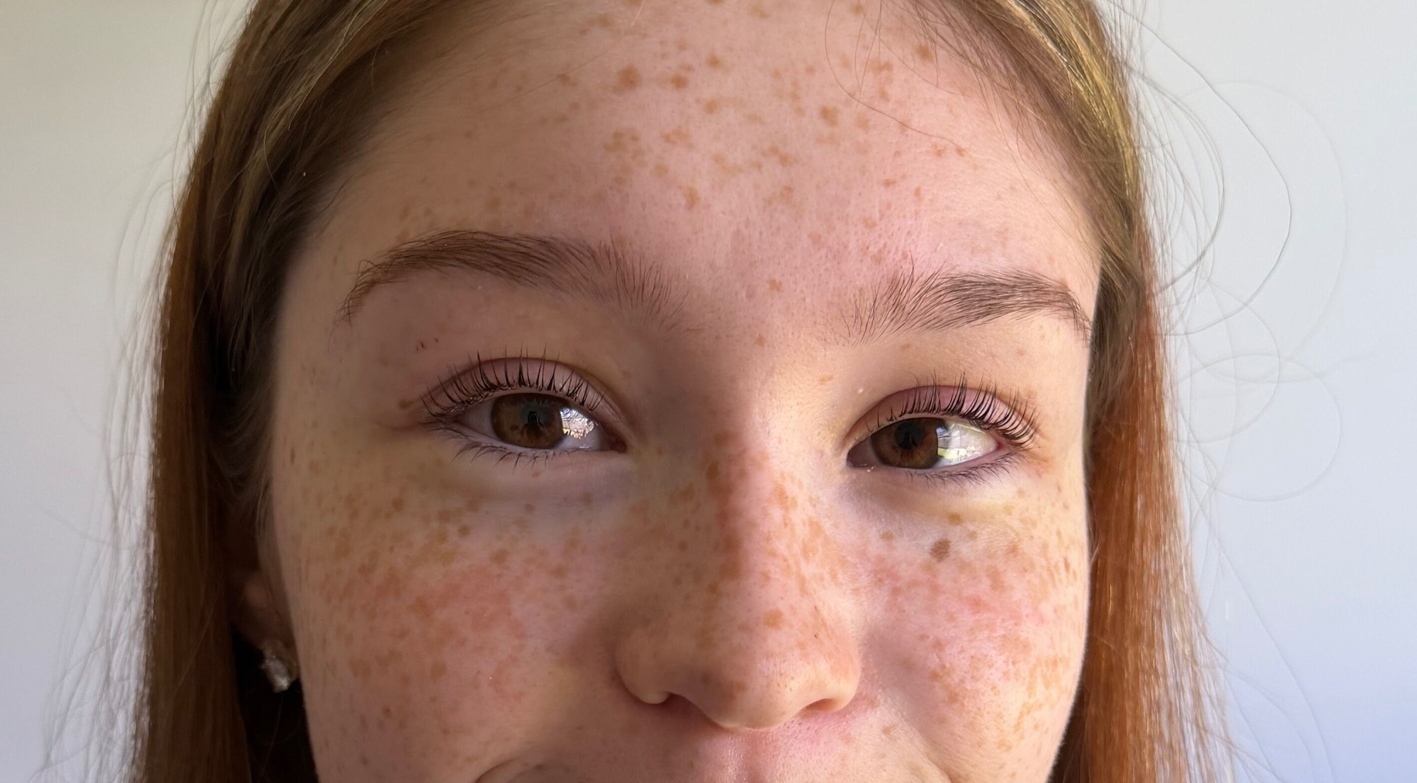 Close-up of a woman's face showcasing natural beauty at West Beauty Haus - RBP, Redbank Plains, Queensland, AU.