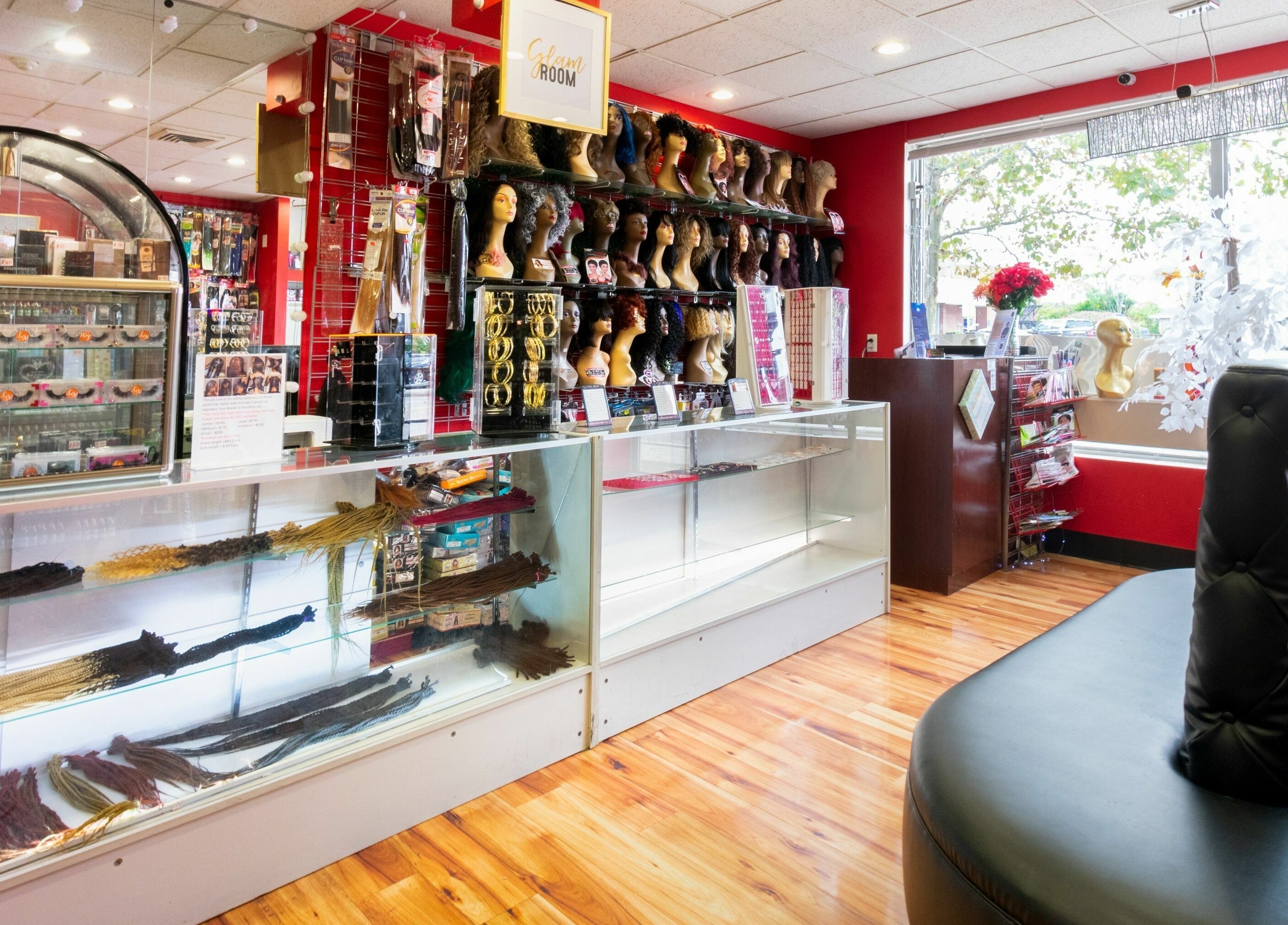 Vibrant interior of NADEGE CREATION - RANDOLPH in Randolph, Massachusetts, US showcasing hairpieces and products.