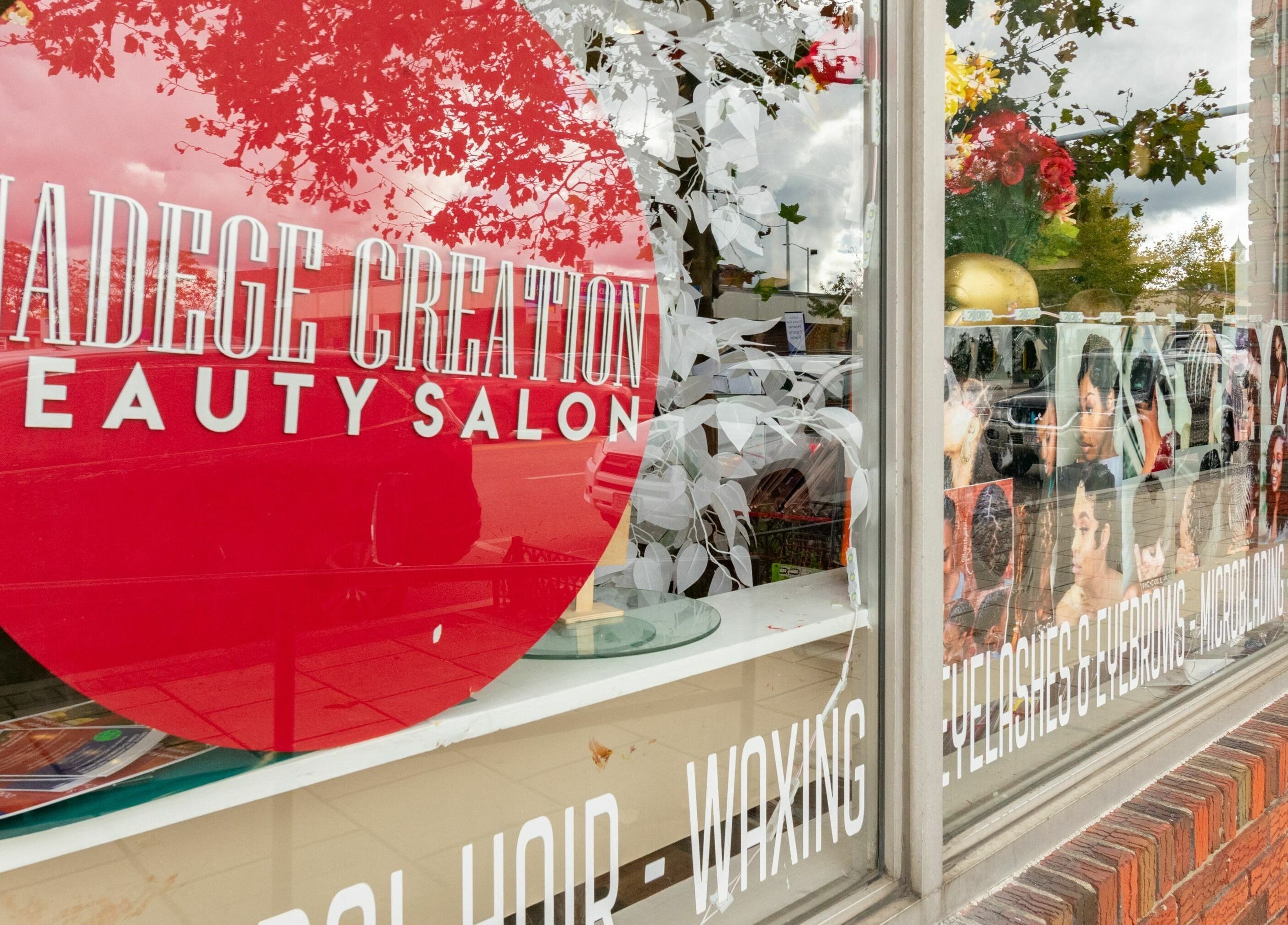 Front window of NADEGE CREATION - RANDOLPH in Randolph, Massachusetts, US, featuring beauty salon graphics.