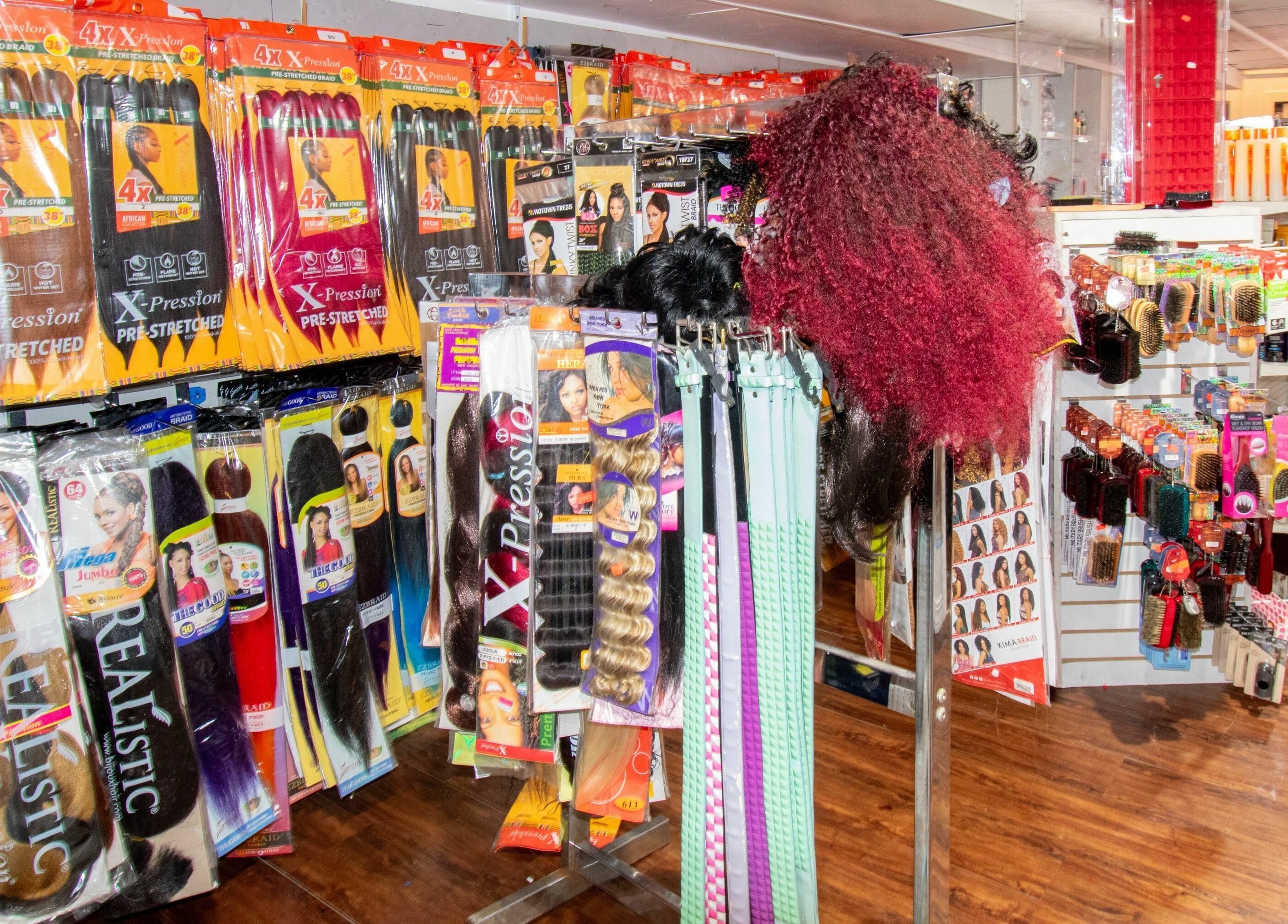 Hair products display at NADEGE CREATION - RANDOLPH, Randolph, Massachusetts, US featuring vibrant extensions.