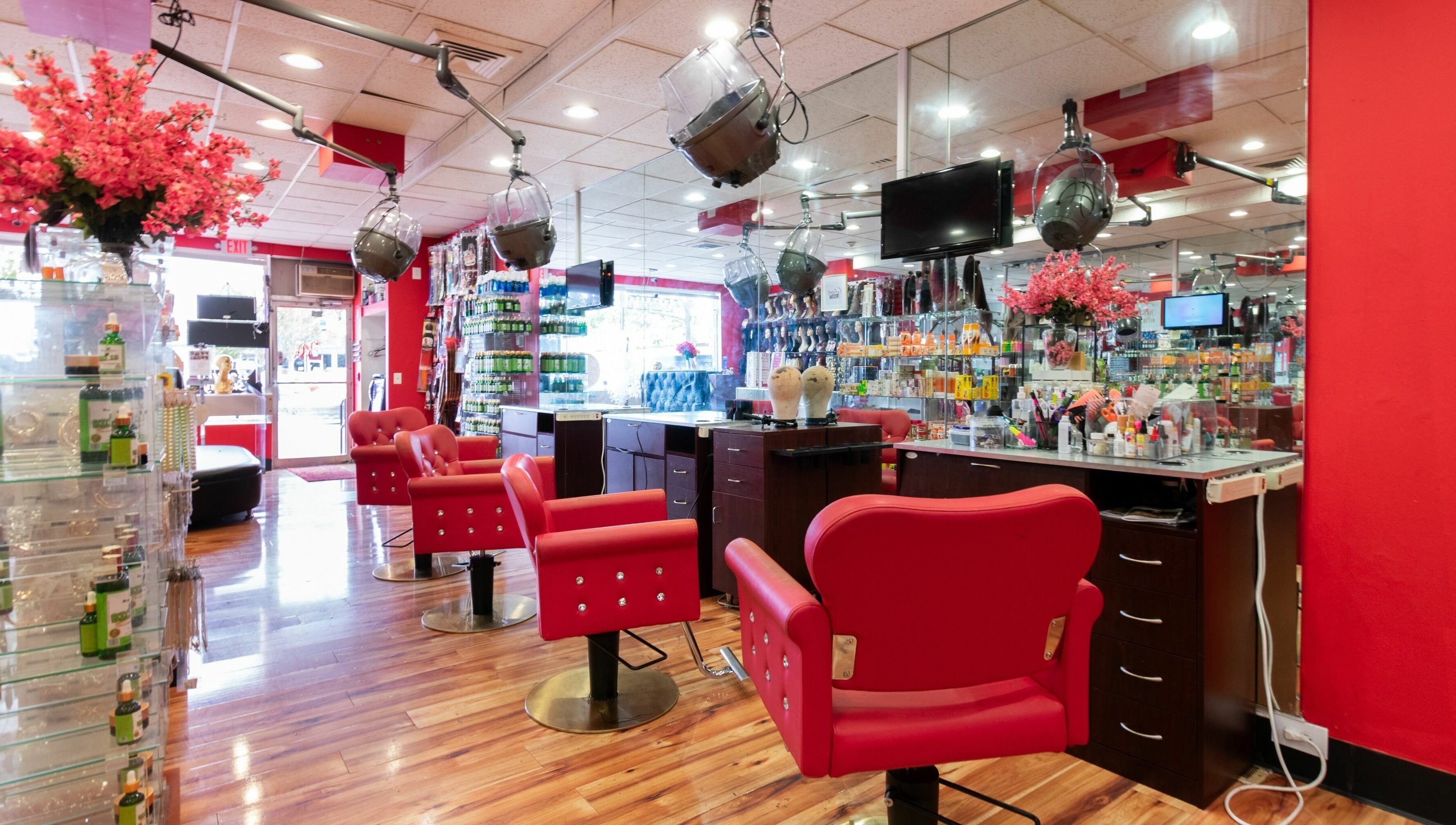 Vibrant salon interior with red accents at Nadege Creation - SOUTH SHORE PLAZA, Braintree, Massachusetts, US.
