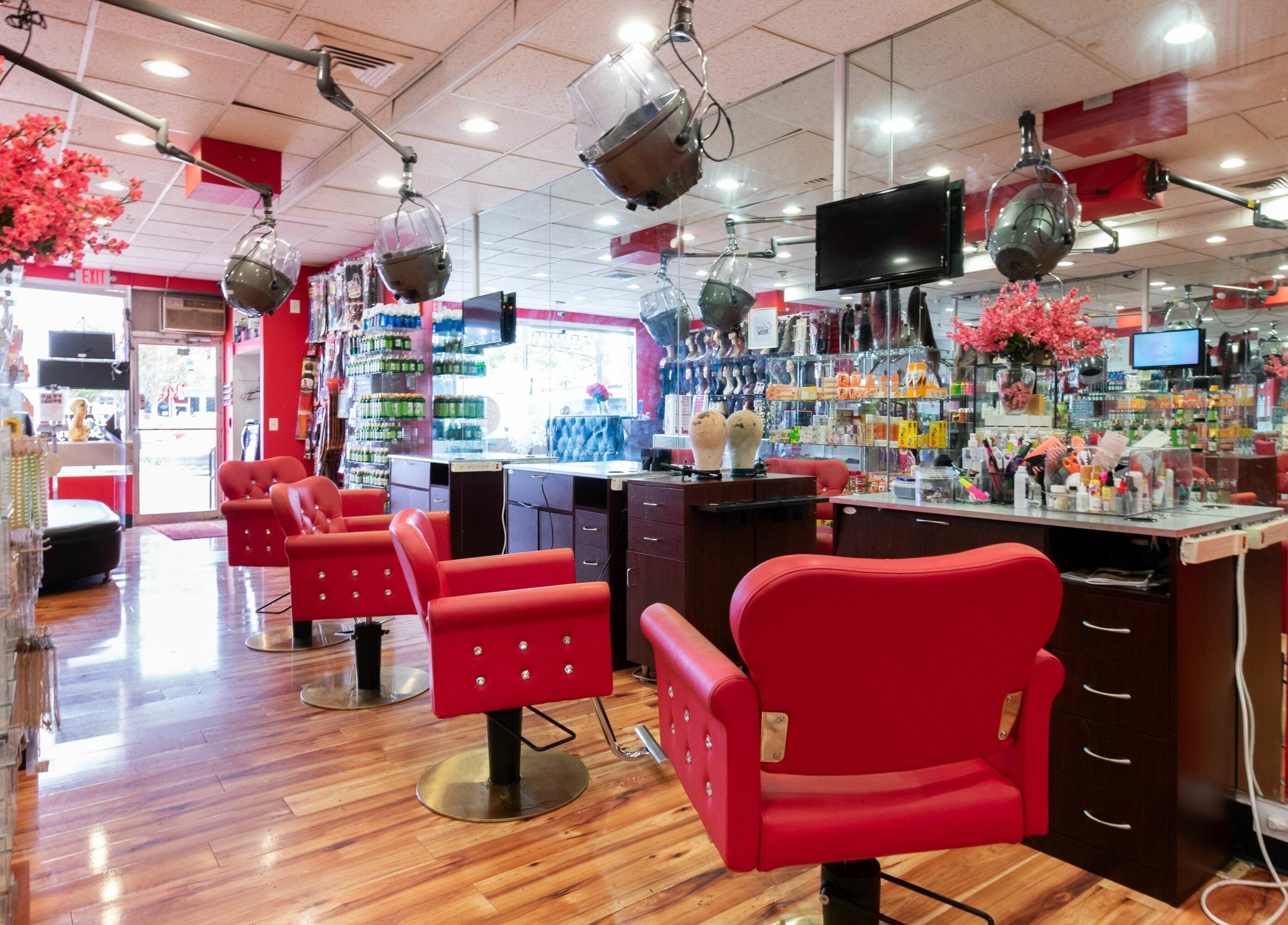 Vibrant salon interior with red accents at Nadege Creation - SOUTH SHORE PLAZA, Braintree, Massachusetts, US.