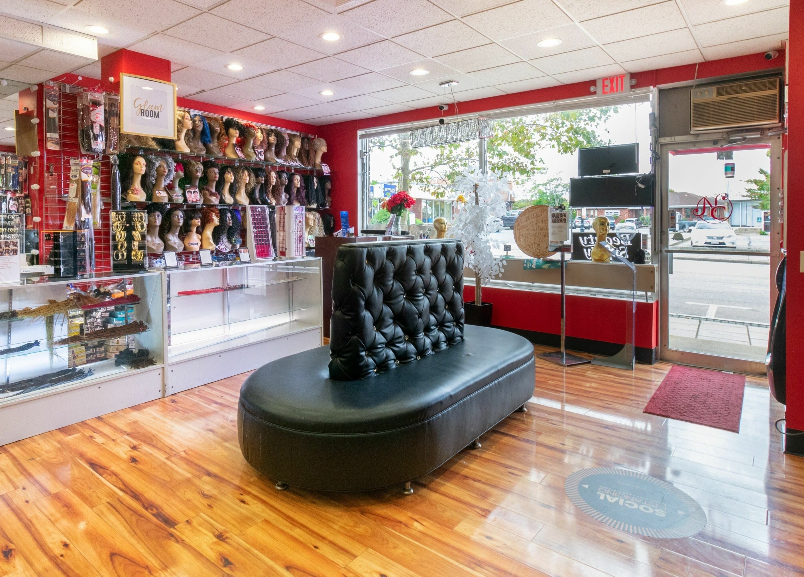 Nadege Creation - SOUTH SHORE PLAZA features elegant interior with wig displays in Braintree, Massachusetts, US.