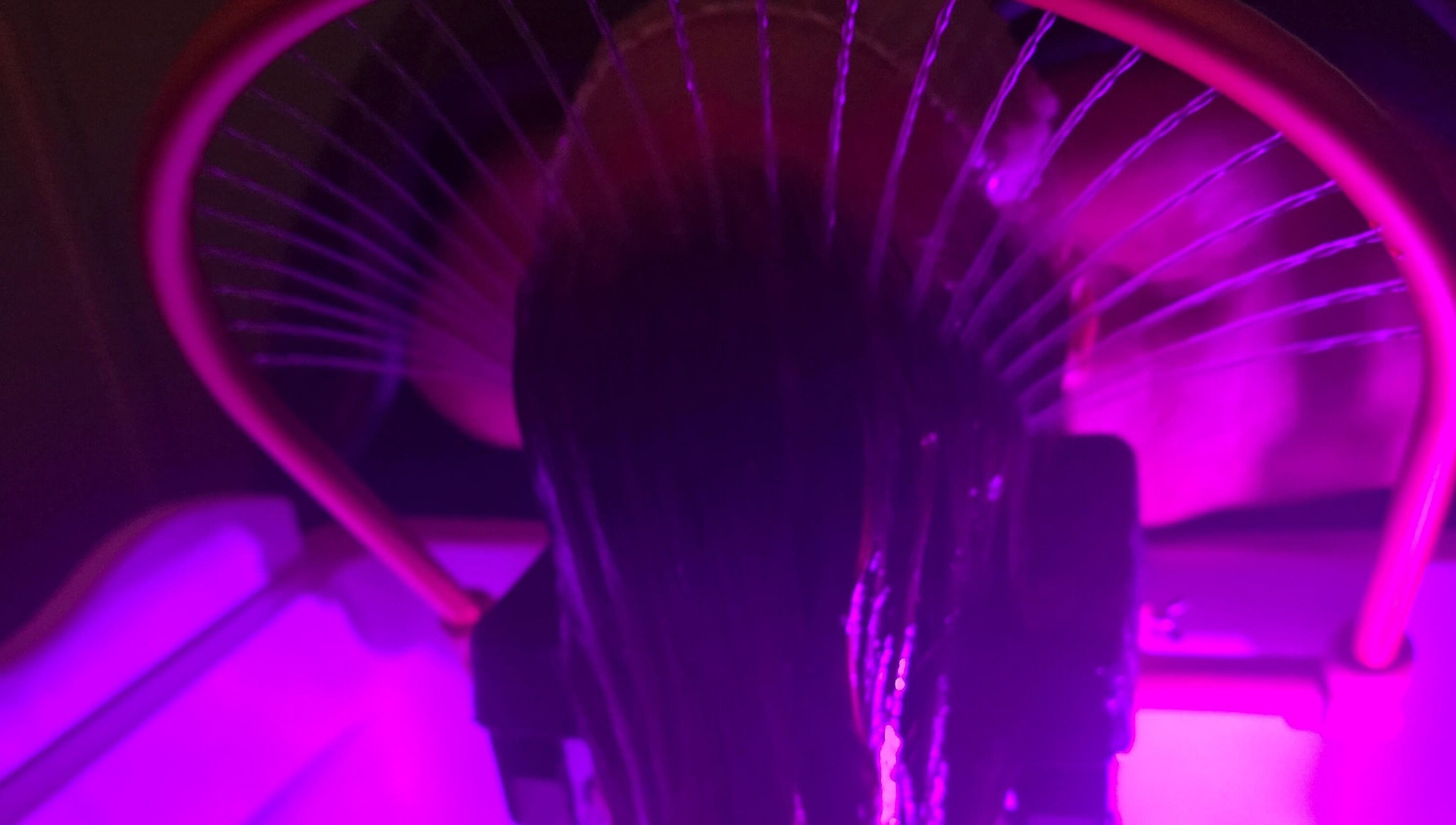 Vibrant hair treatment at Inner Beauty by Kirsty, Carrickfergus, Northern Ireland, GB, in soft purple lighting.