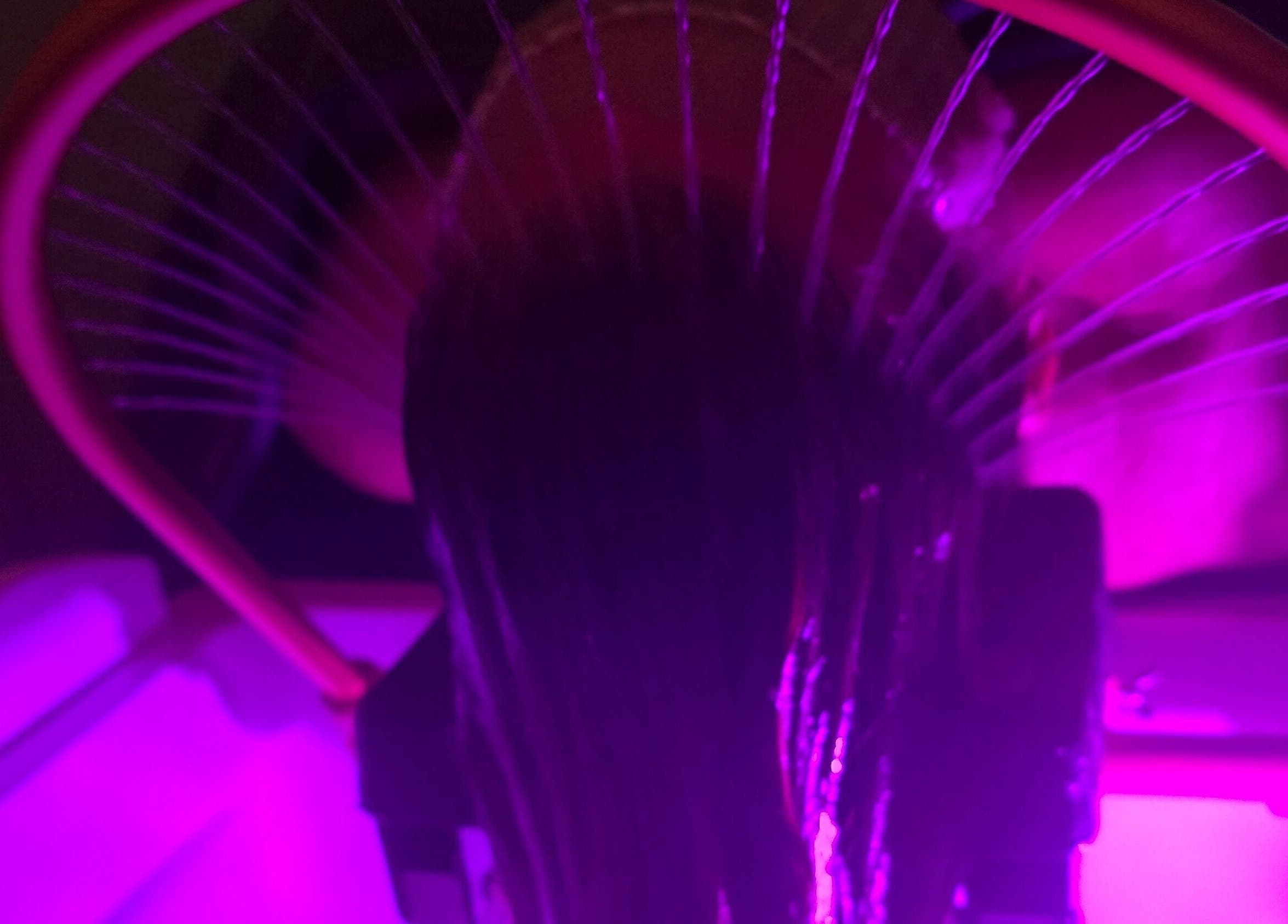 Vibrant hair treatment at Inner Beauty by Kirsty, Carrickfergus, Northern Ireland, GB, in soft purple lighting.